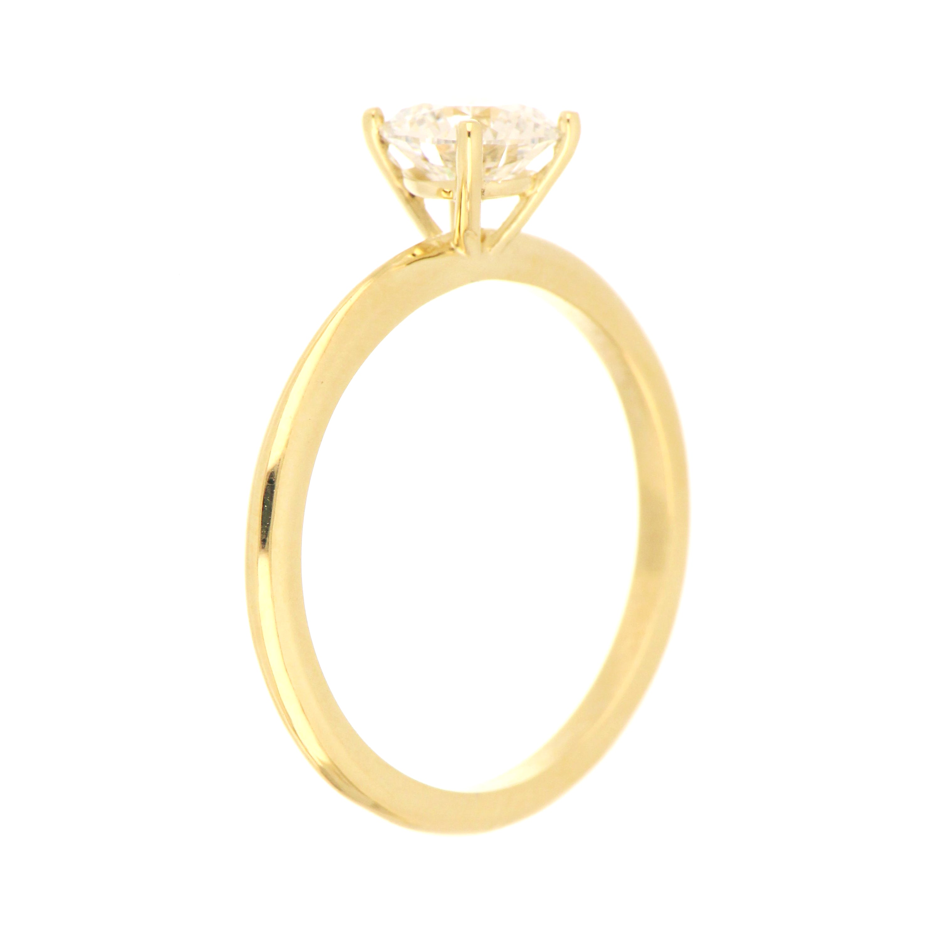 Side angle view of 14kt yellow gold solitaire engagement ring with round lab grown diamond, weighing 2.28 grams total
