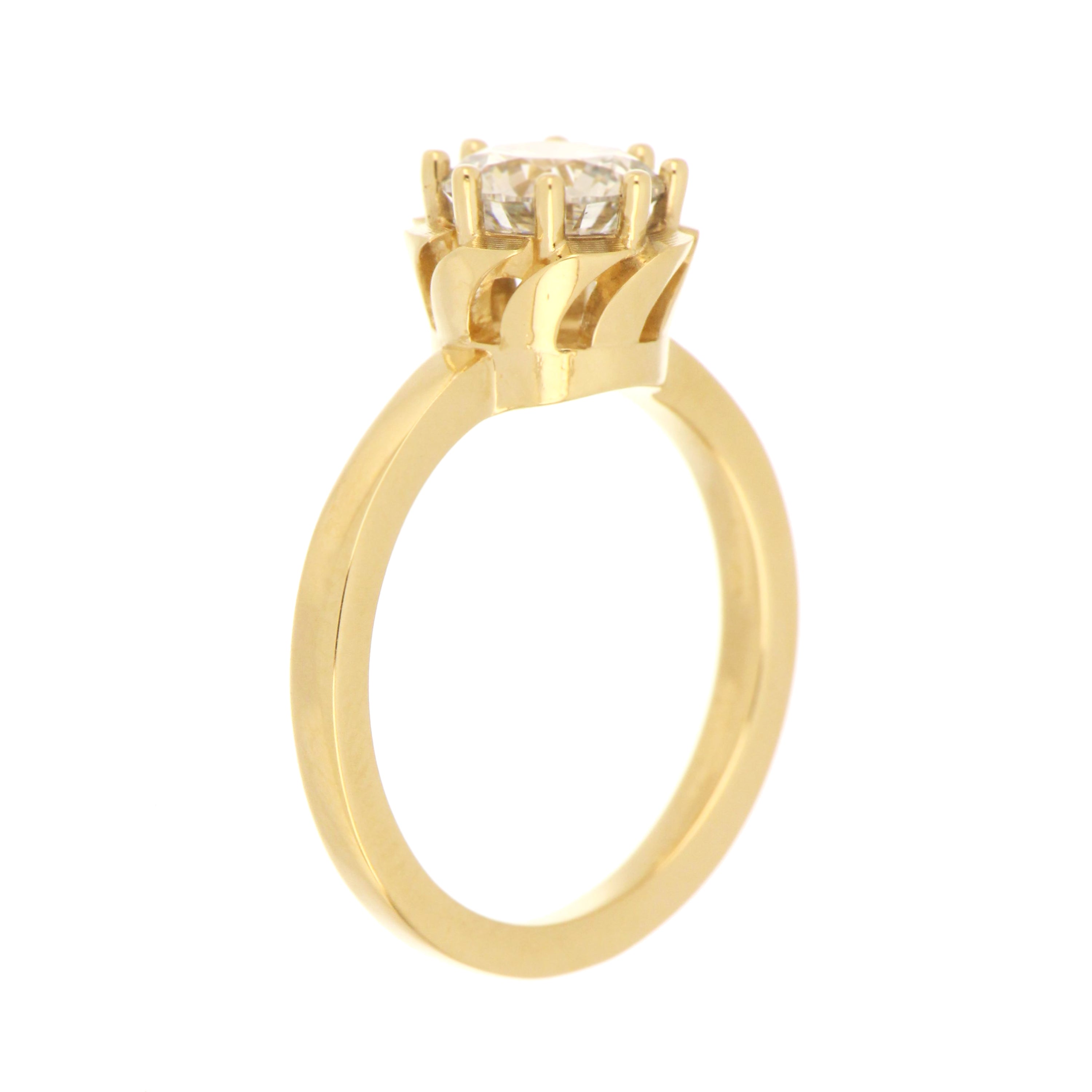 Side angle of polished yellow gold shank on solitaire diamond ring, showing profile and band