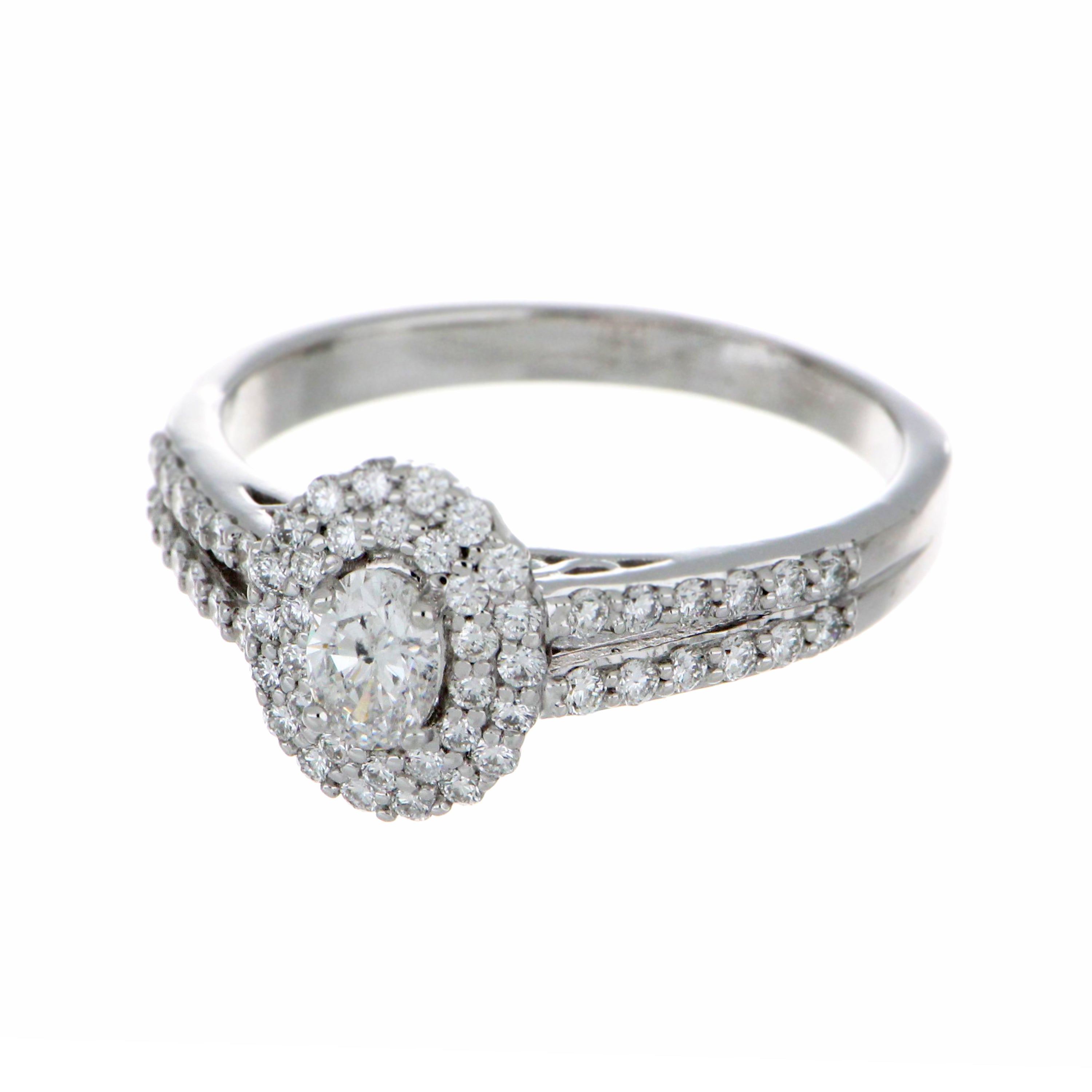 Top-down view of oval center diamond ring with polished white gold shank and surrounding side diamonds