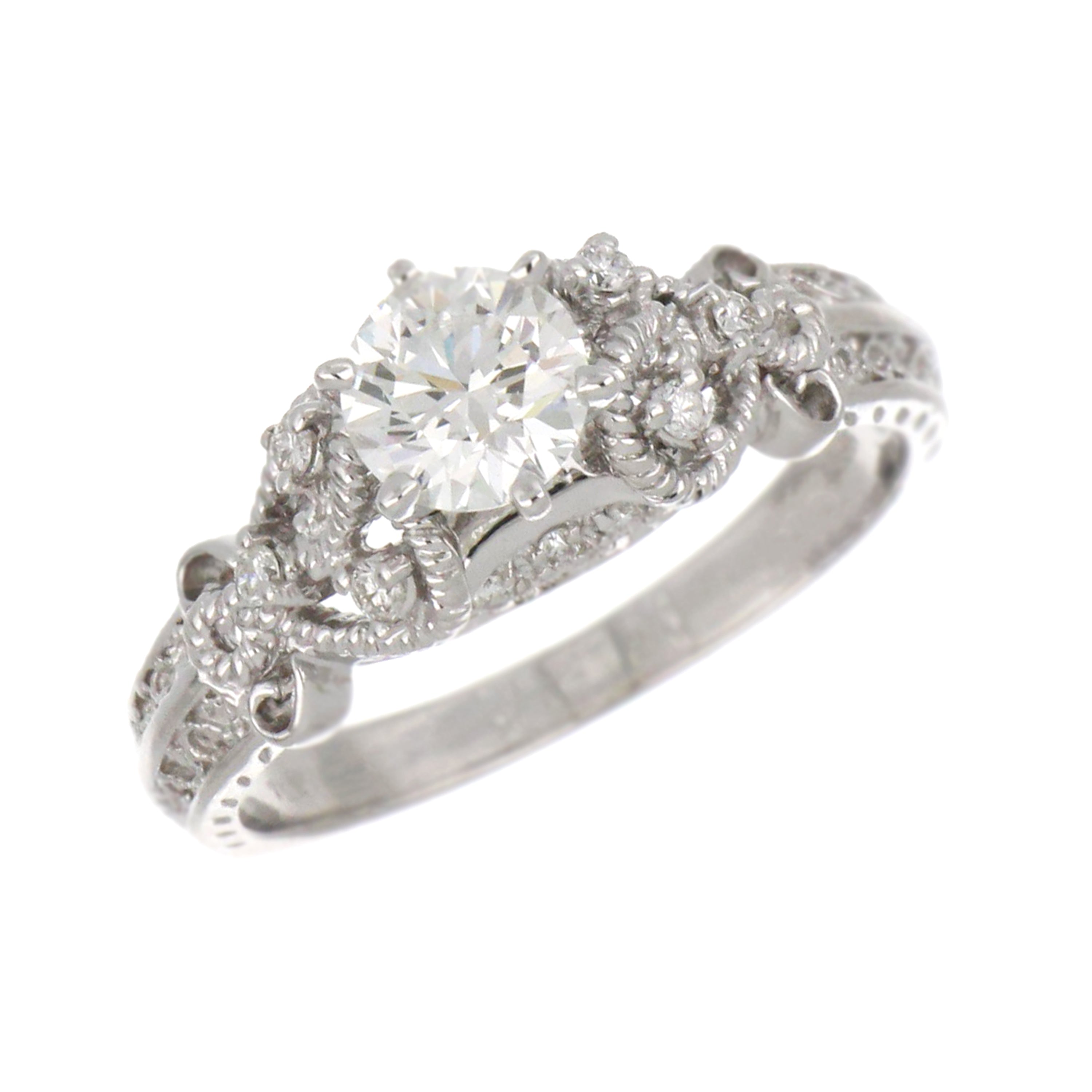 18kt white gold diamond ring showing round brilliant center diamond and side diamonds on polished band