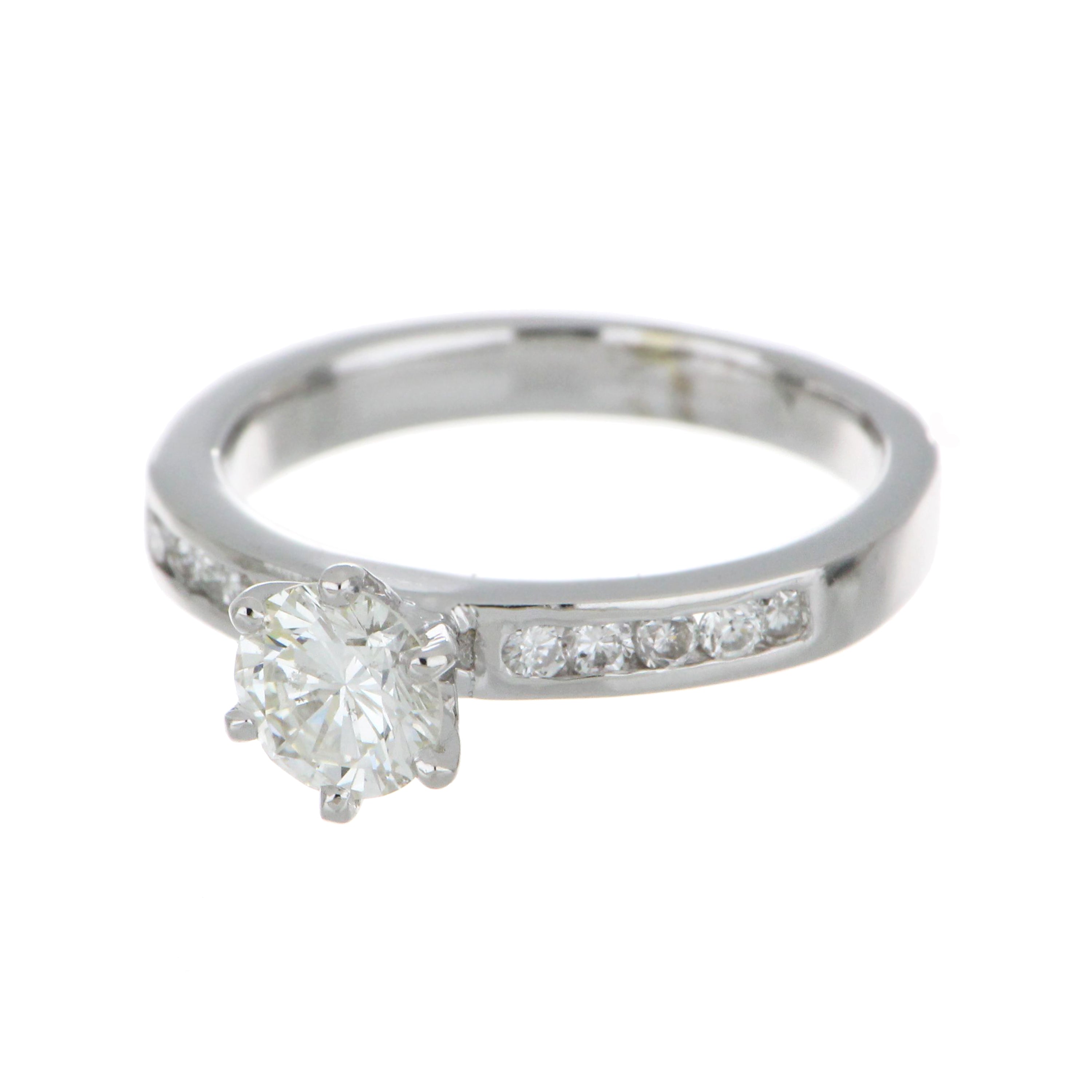 Detailed close-up display of the 10 small round diamonds set in channel style along white gold band