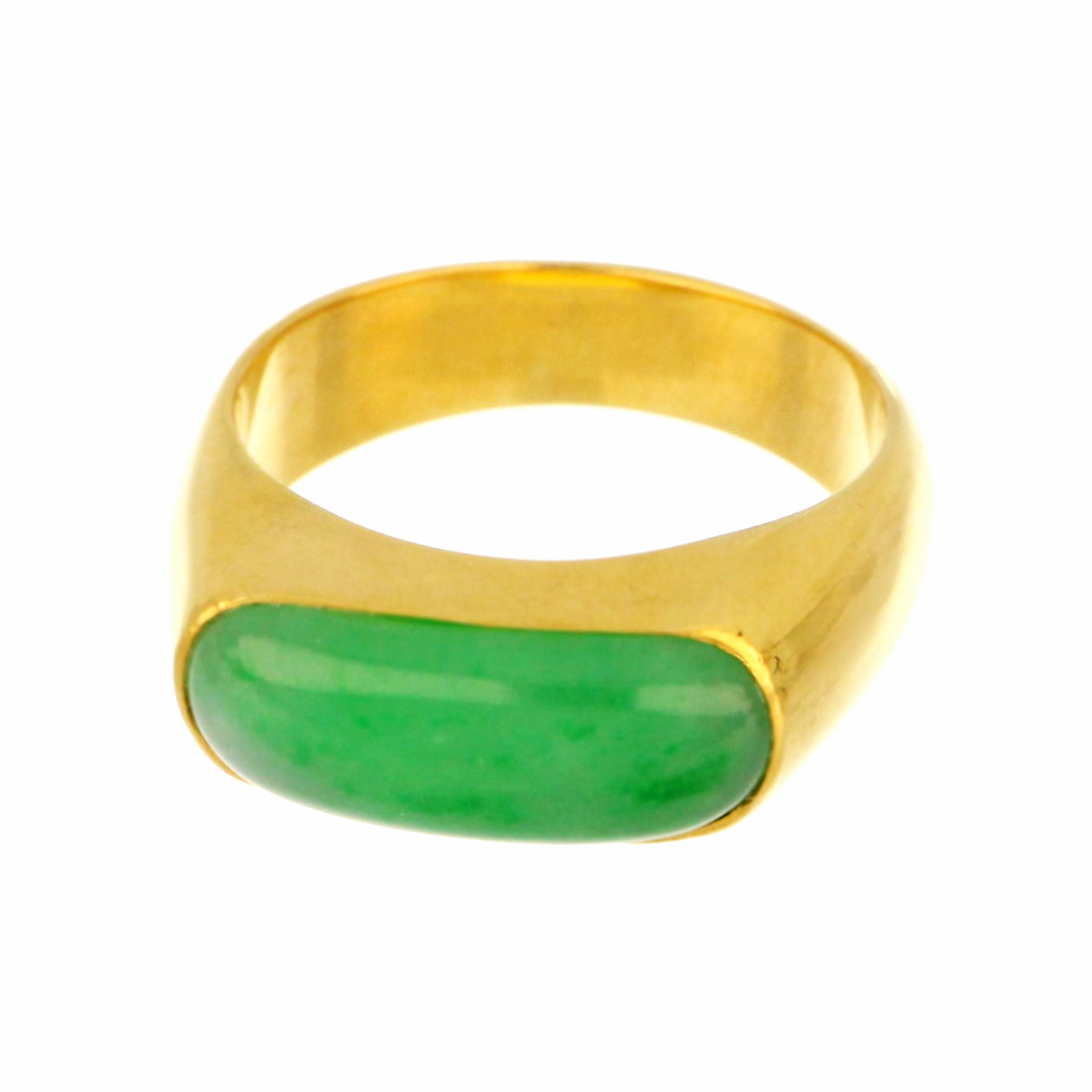 Detailed shot of jade ring showcasing texture of saddle-shaped natural jadeite and gleaming 18kt yellow gold setting