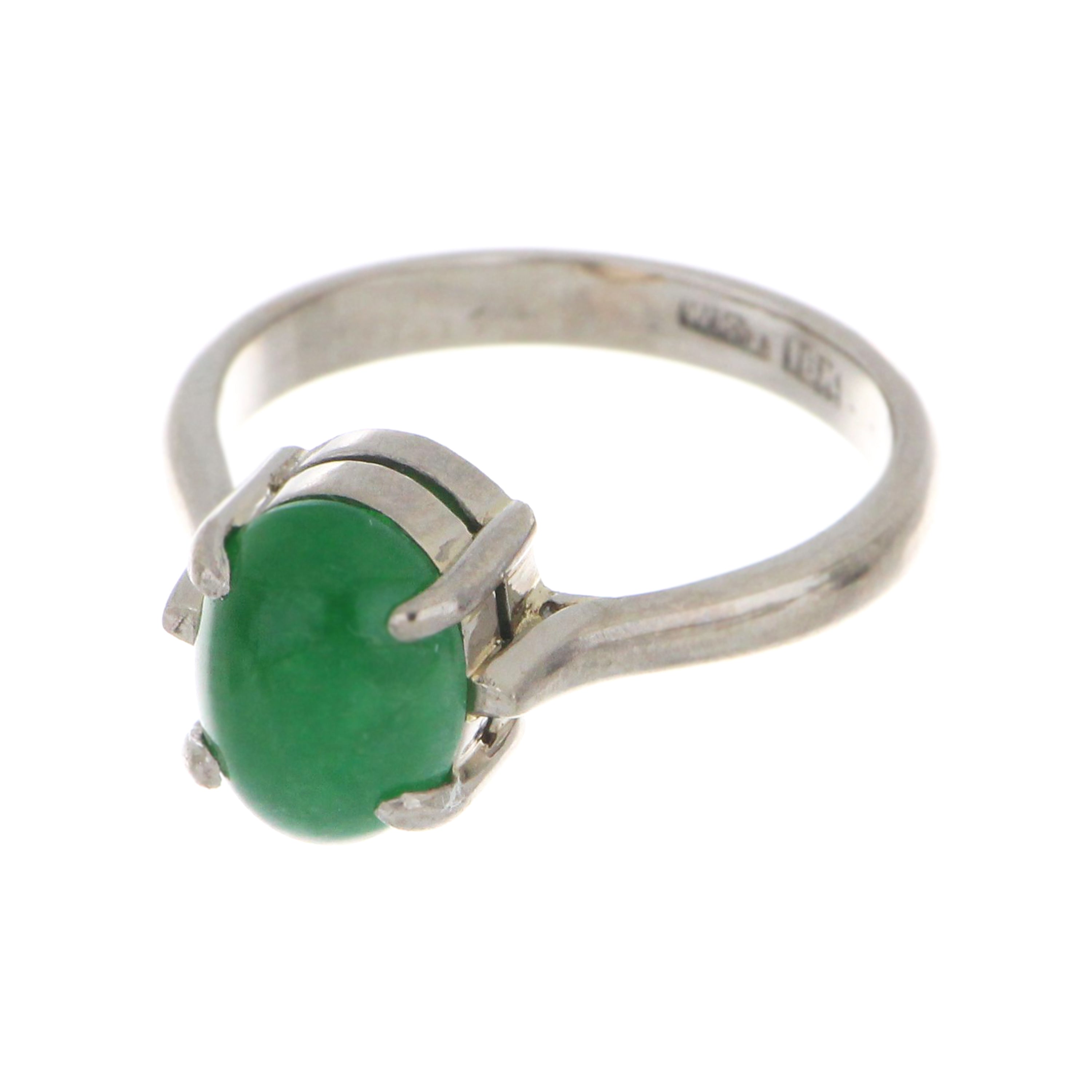 Top view of elegant 18kt white gold ring with natural oval cabochon jadeite jade stone, ring size 5