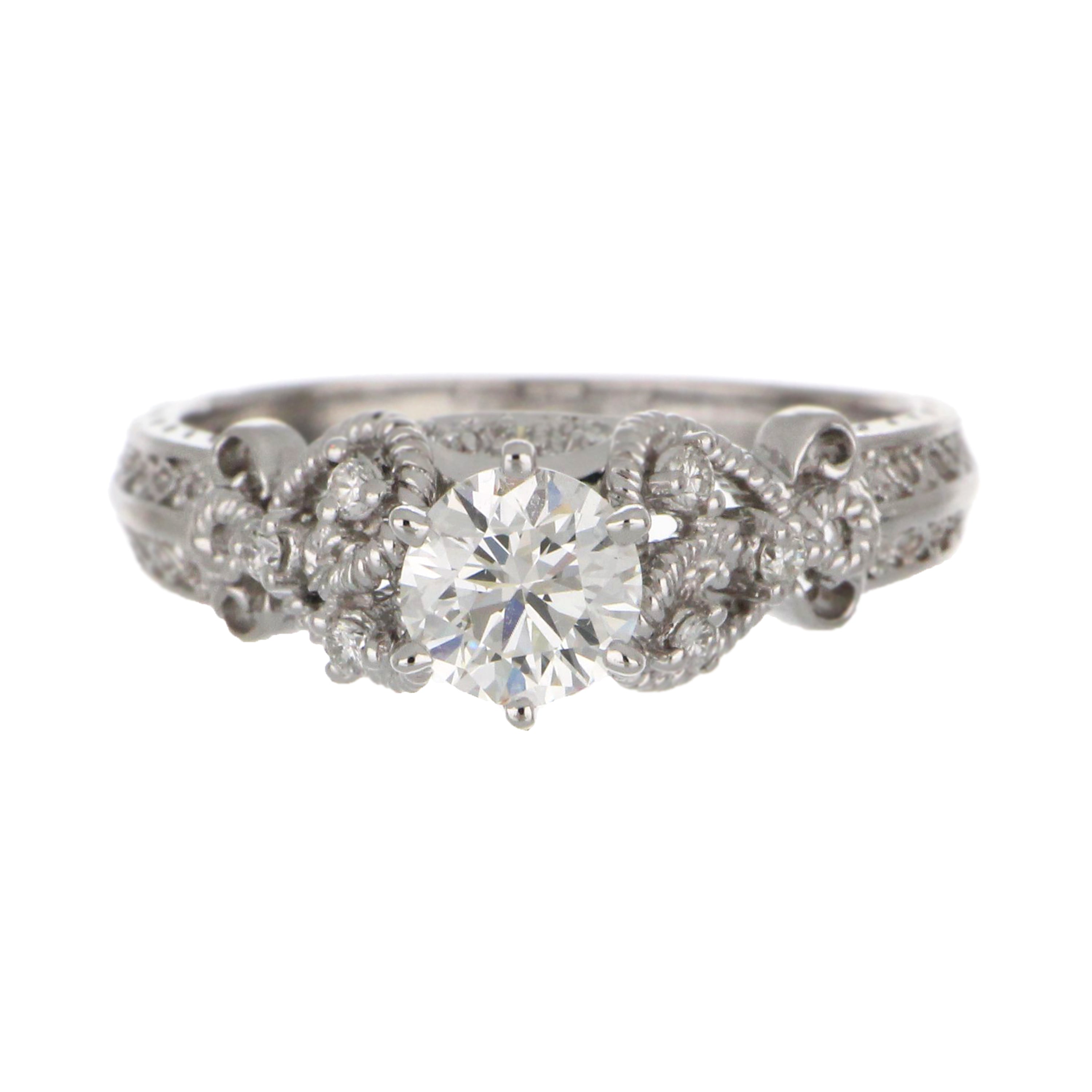 Close-up of claw set round brilliant diamonds on 18kt white gold engagement ring