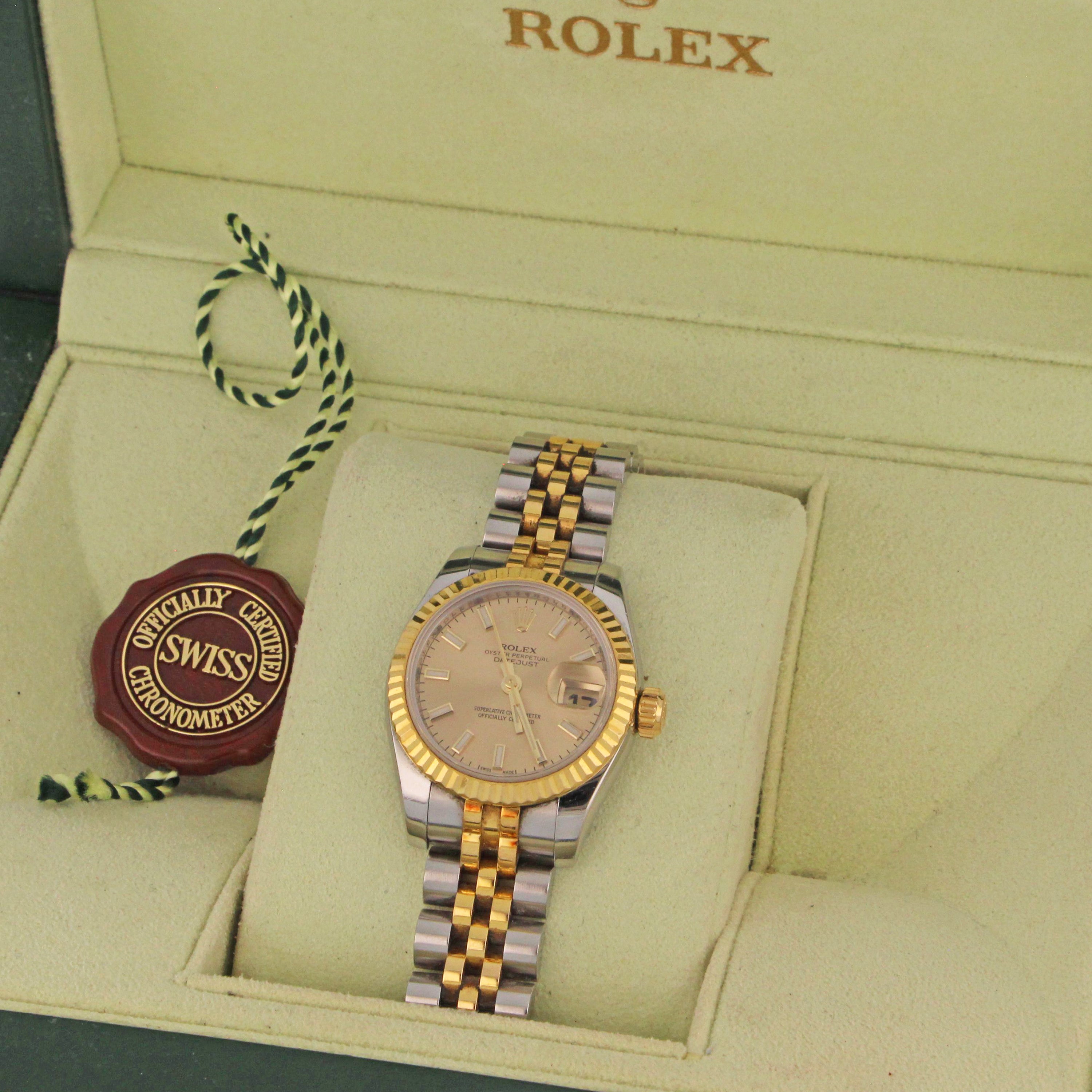 Rolex box with Ladies Oyster Perpetual Datejust watch inside, showcasing luxury presentation