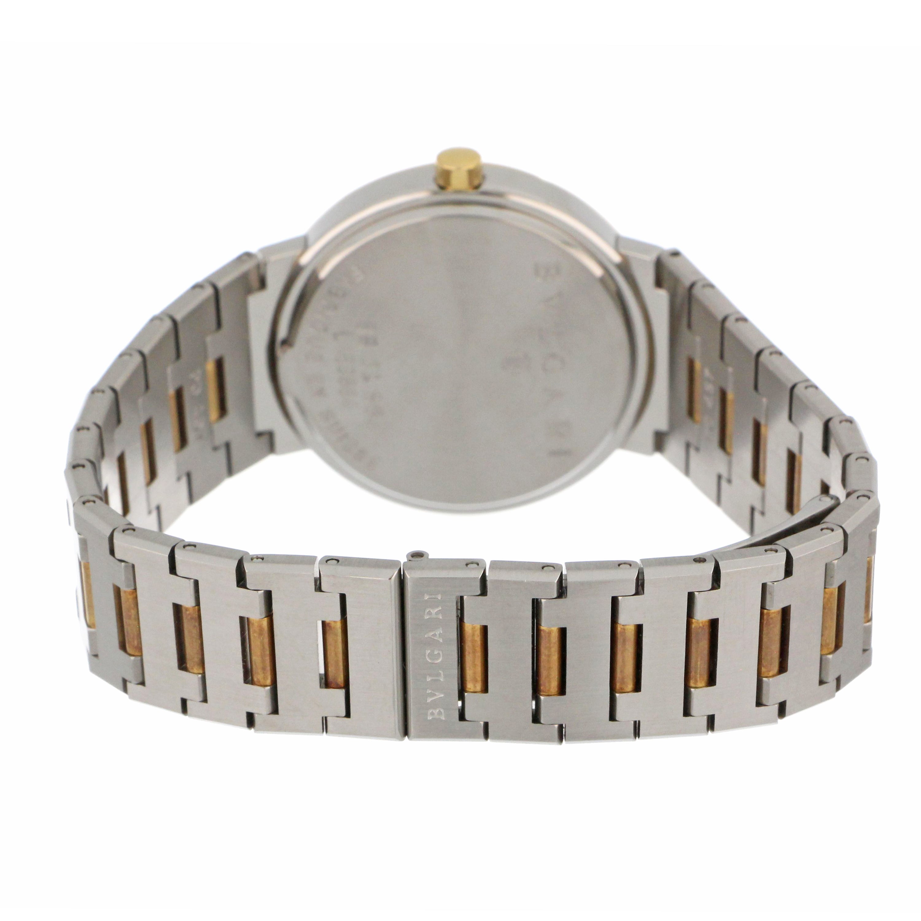 Luxury pre-owned Mens' Bvlgari watch angled to highlight 18kt yellow gold bezel and black dial contrast
