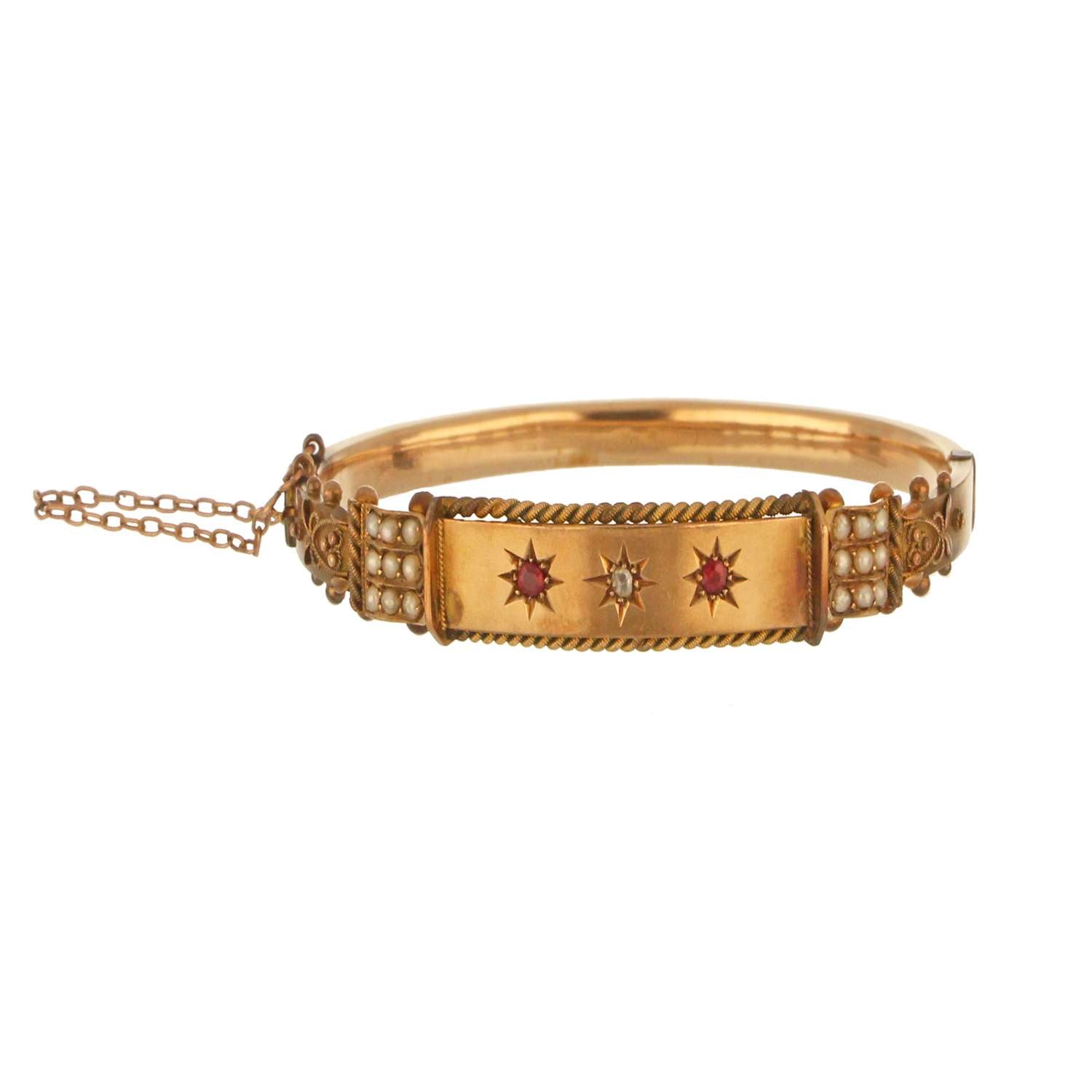 9kt yellow gold antique bangle with rubies, rose-cut diamond, and seed pearls