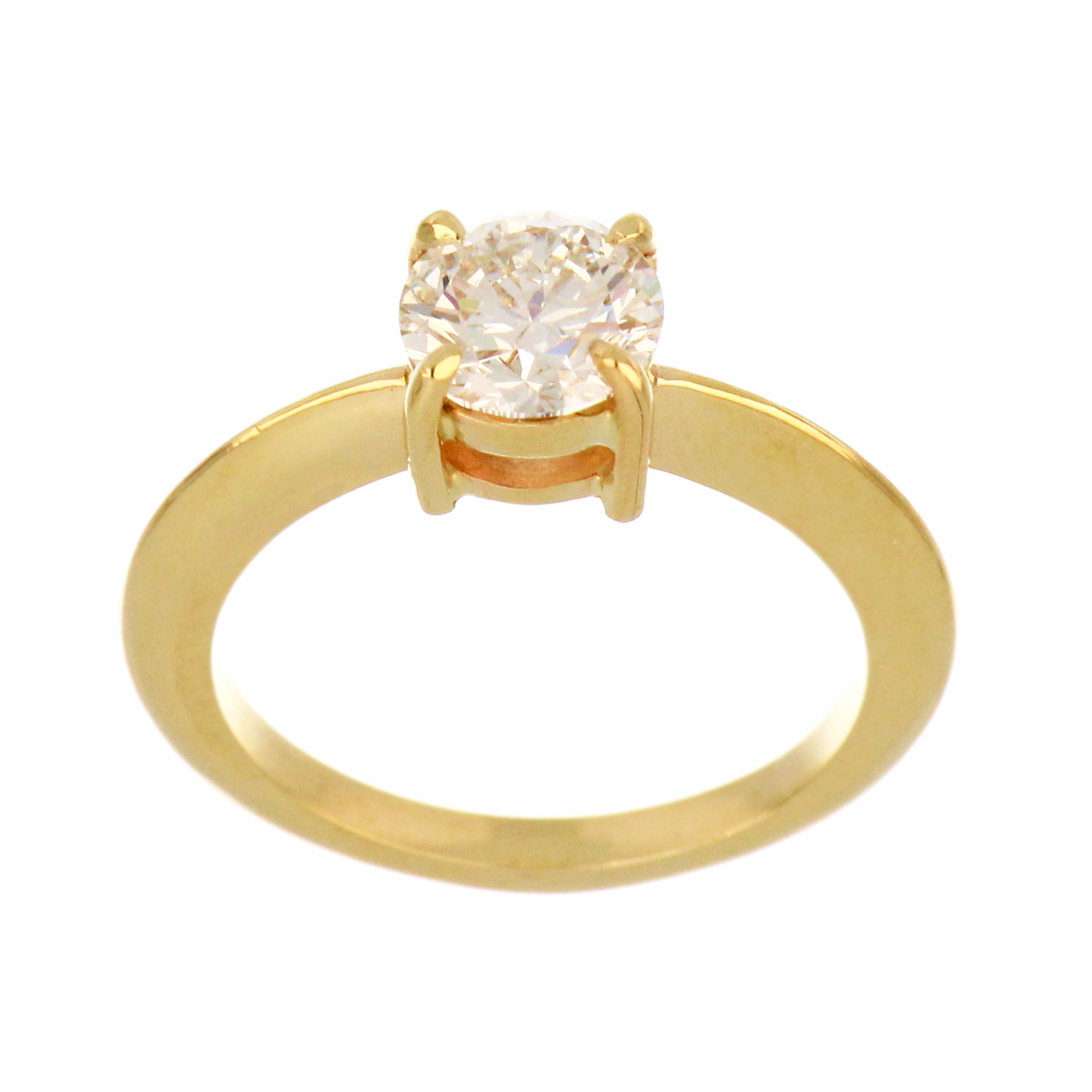 14kt yellow gold solitaire engagement ring with a round brilliant lab grown diamond, close-up front angle showcasing polished shank