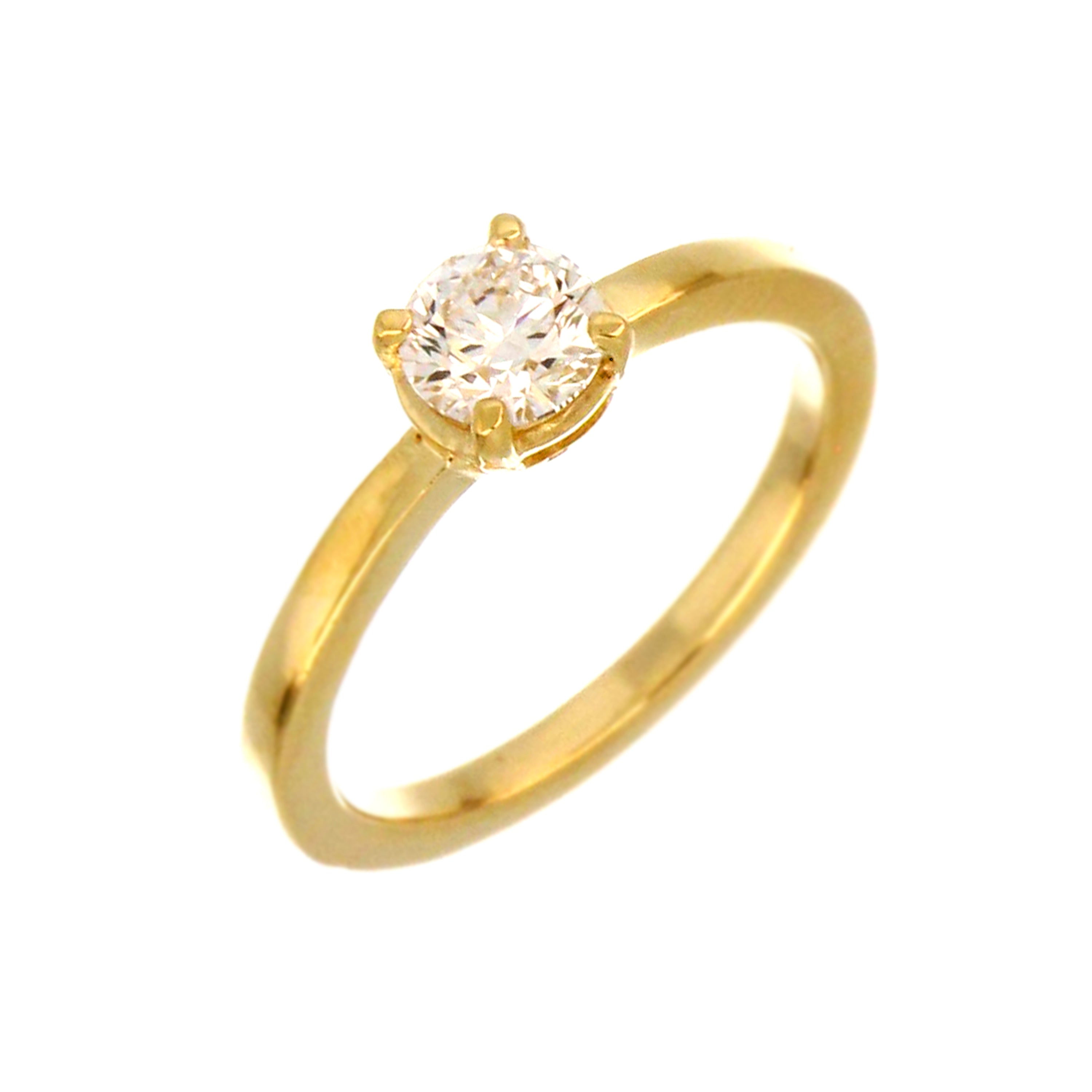 Close-up of claw set round lab grown diamond on polished 14kt yellow gold solitaire engagement ring