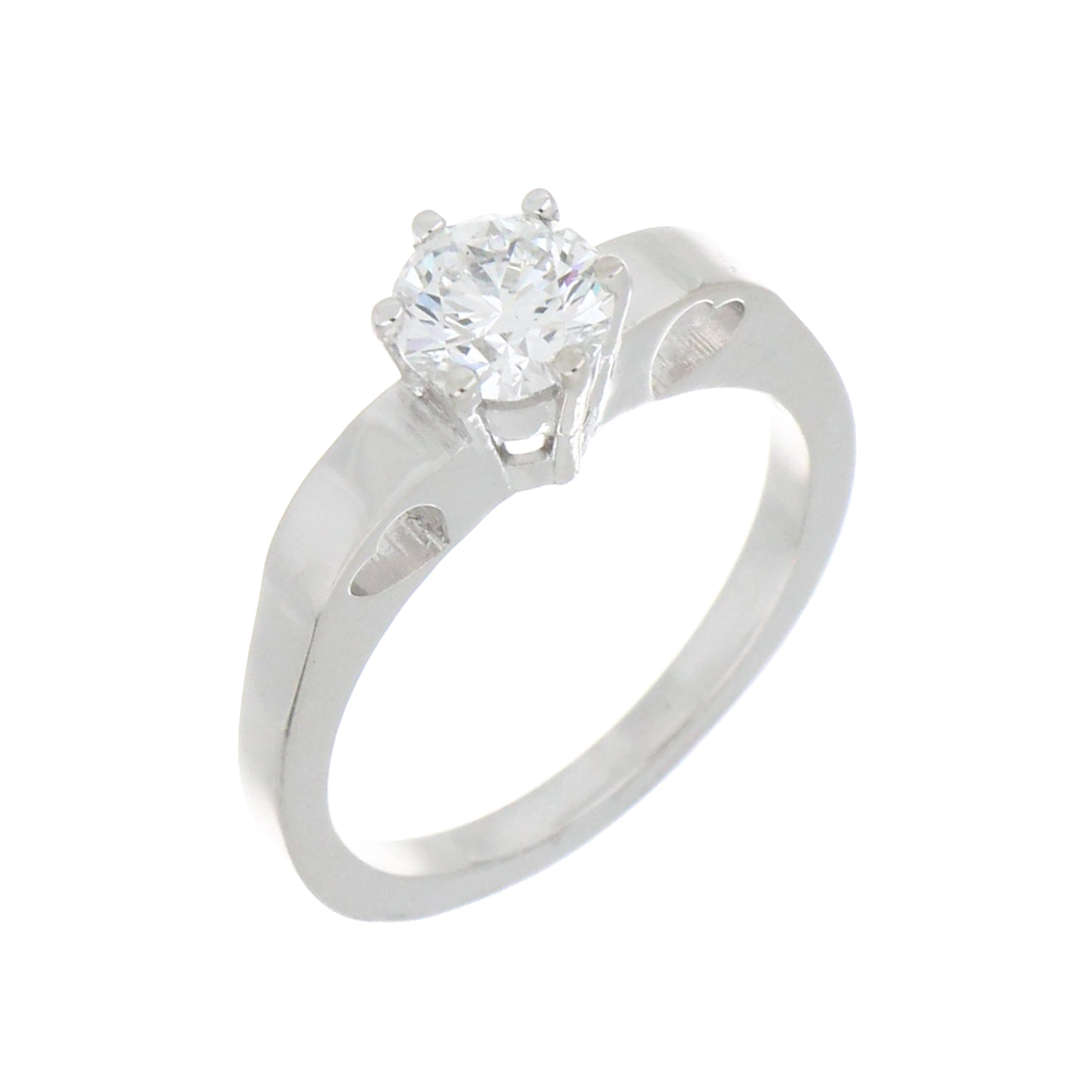 angled view of white gold solitaire diamond ring highlighting heart patterns on each shoulder side