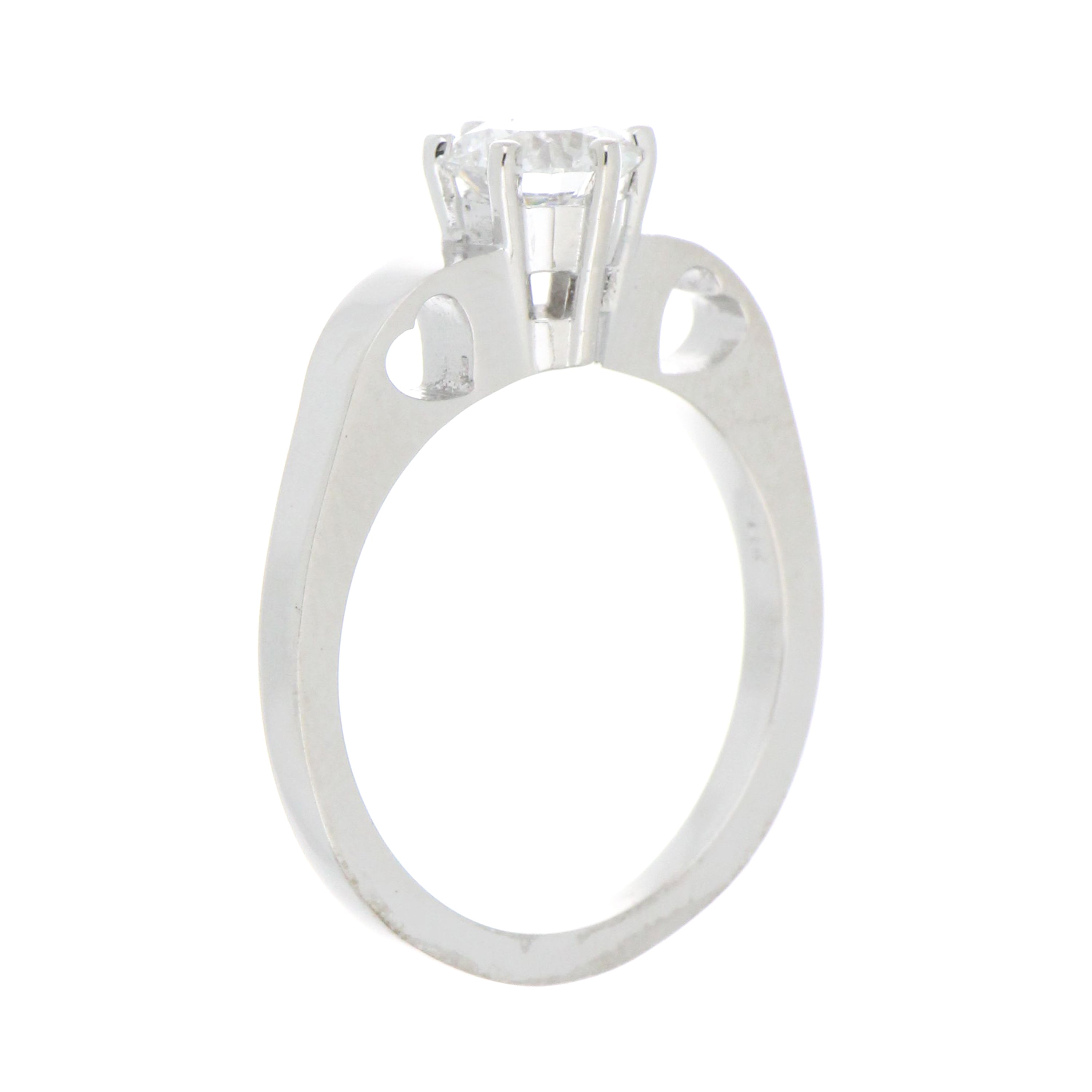detailed shot of ring shank and diamond from side angle emphasizing polished finish and delicate design