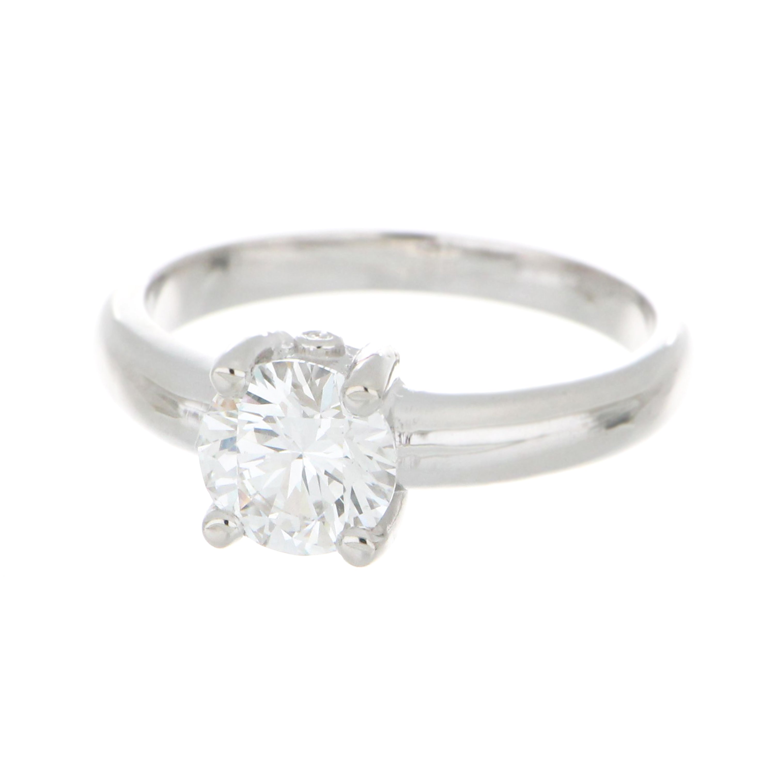 Detailed top angle of lab grown diamond solitaire ring in 14kt white gold, showcasing secure claw setting and smooth domed band