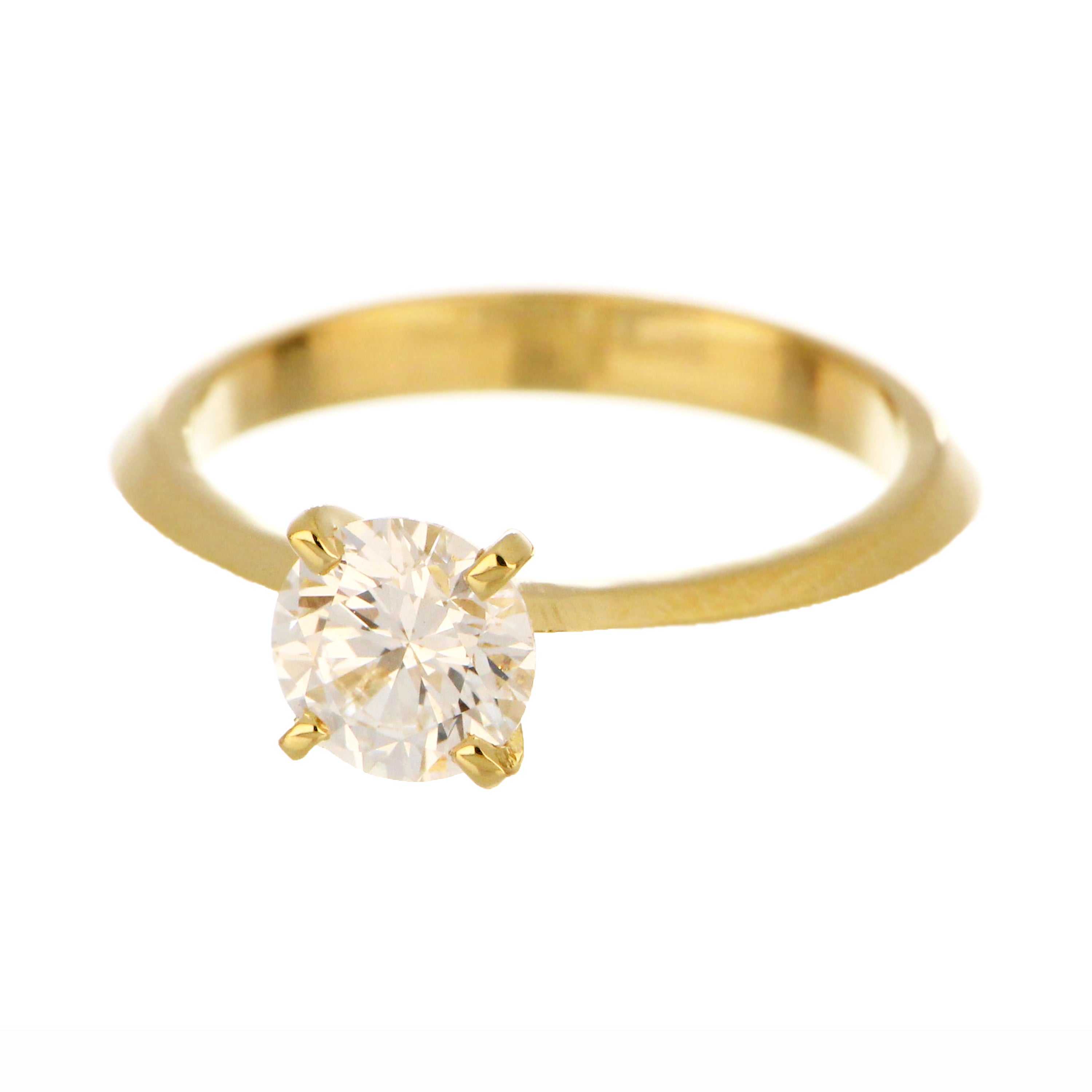 Close-up of round lab grown diamond on 14kt yellow gold ring, showcasing VS1 clarity and E color