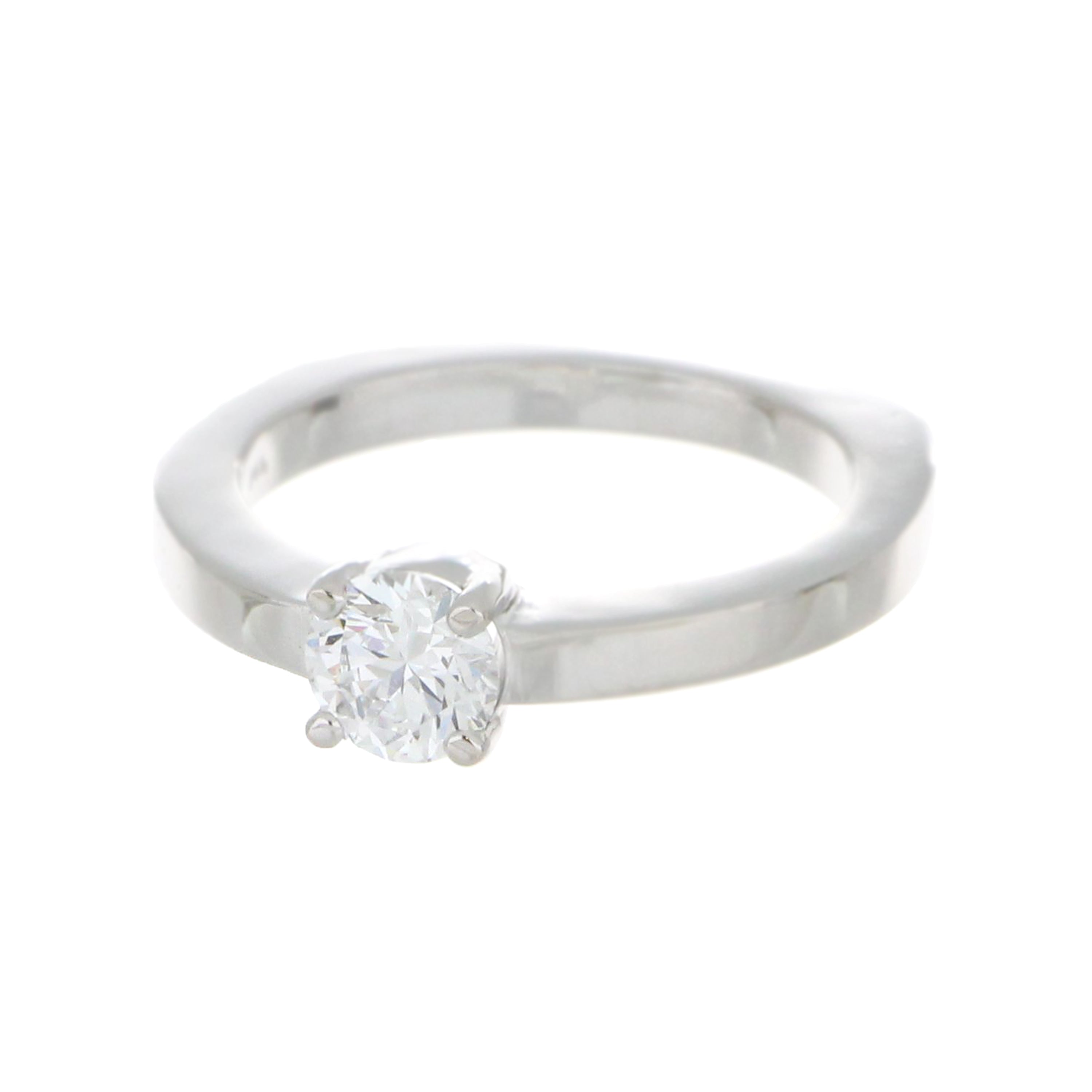 Top angle of lab grown diamond solitaire ring with bright white gold band emphasizing polished finish and precise craftsmanship