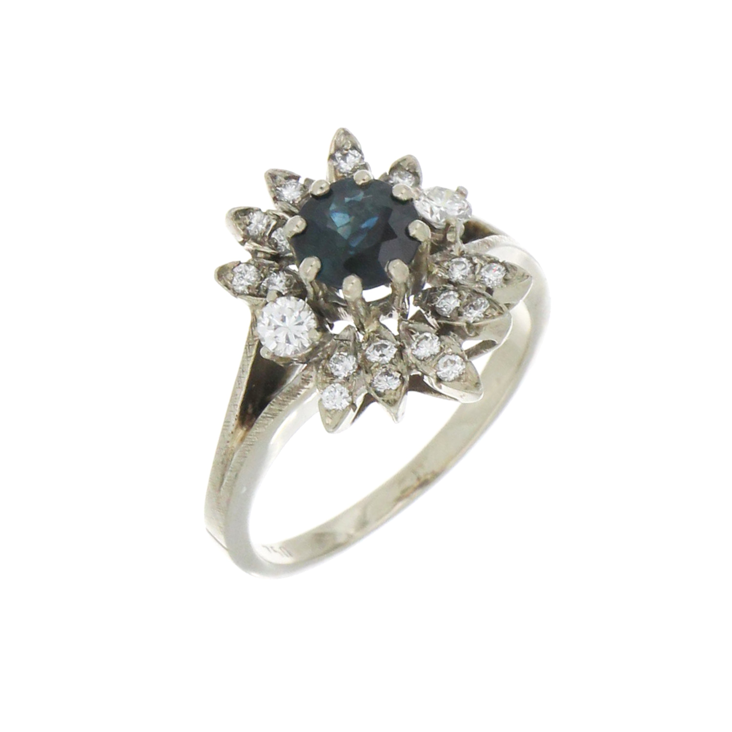close-up of sapphire and diamond floral ring in white gold