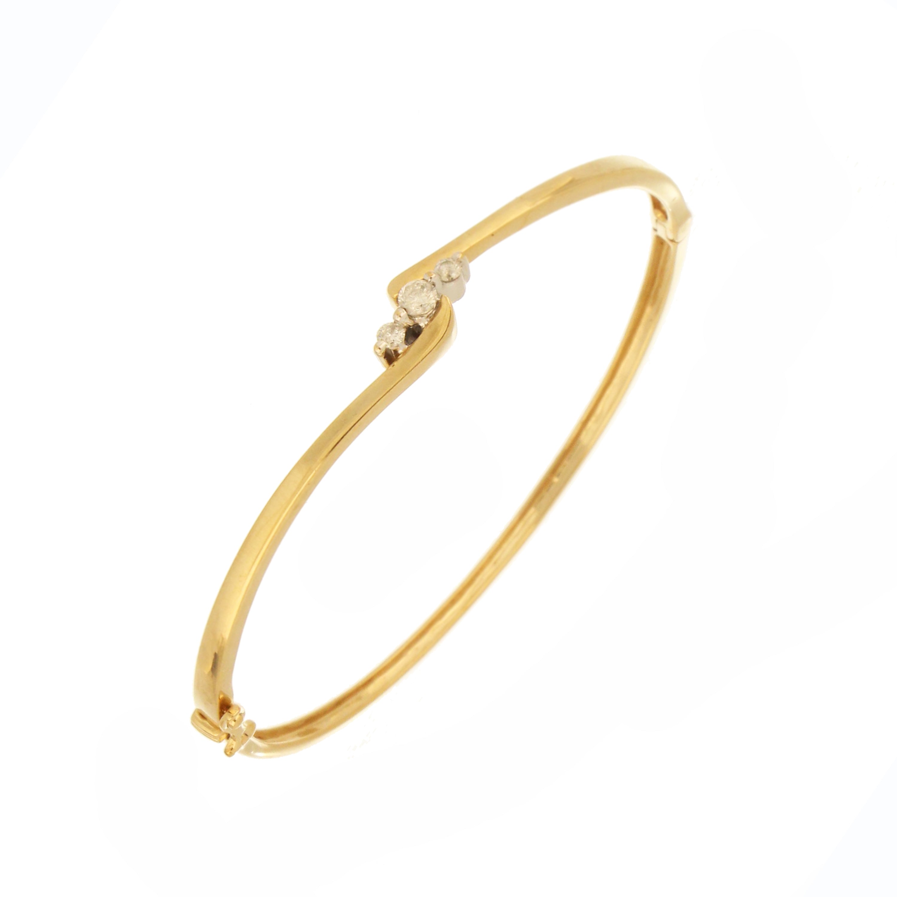 Estate diamond bangle in yellow gold with curved design