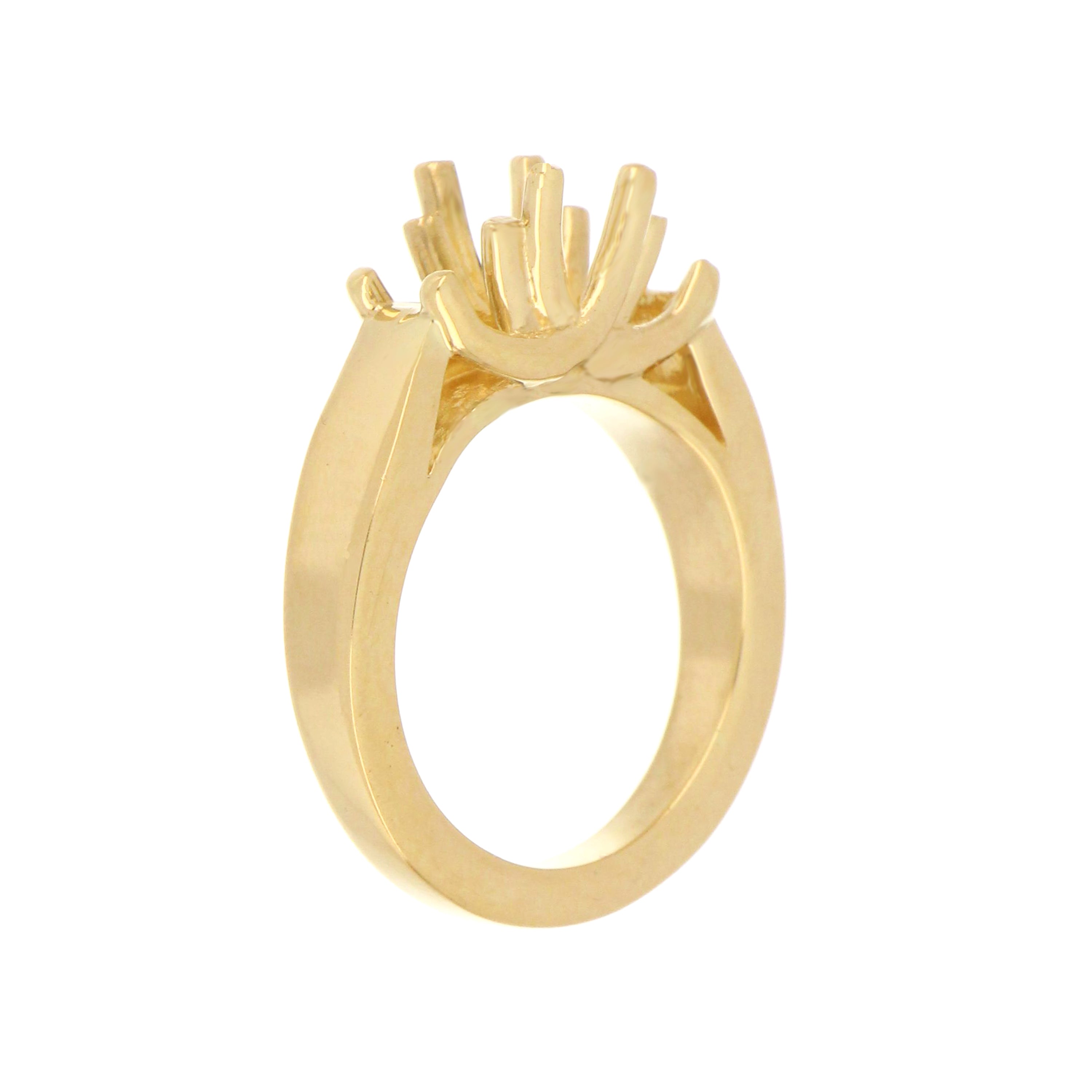Polished 14k yellow gold three-stone ring setting ready for diamonds or gems.