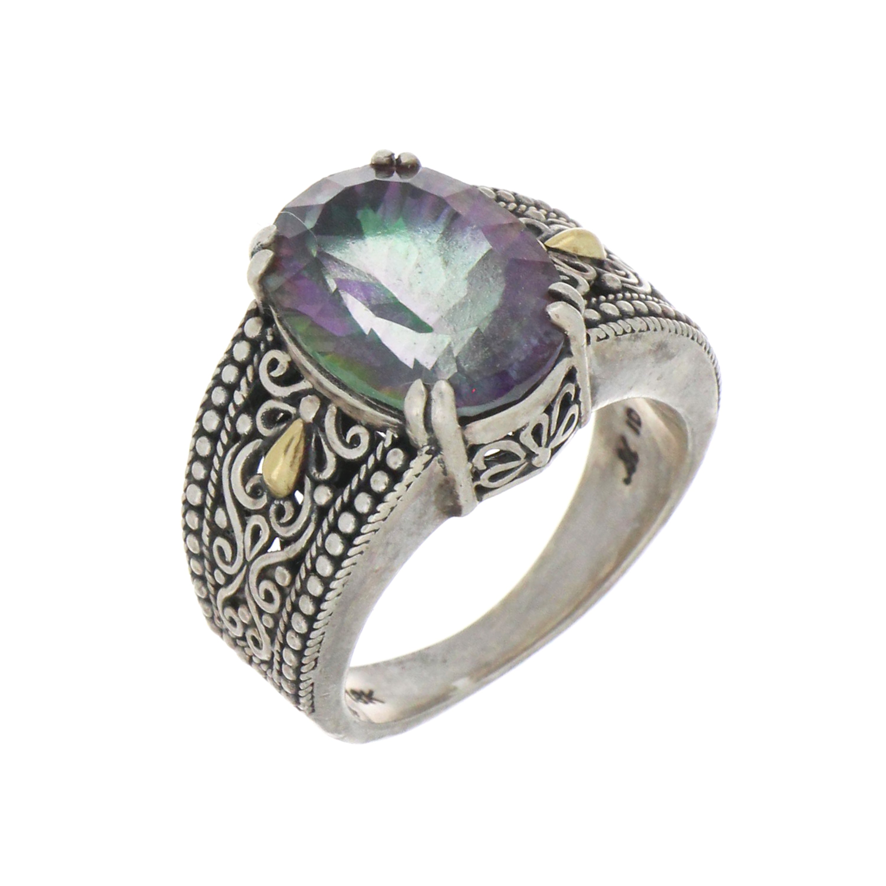 close-up of mystic topaz gemstone in detailed silver setting