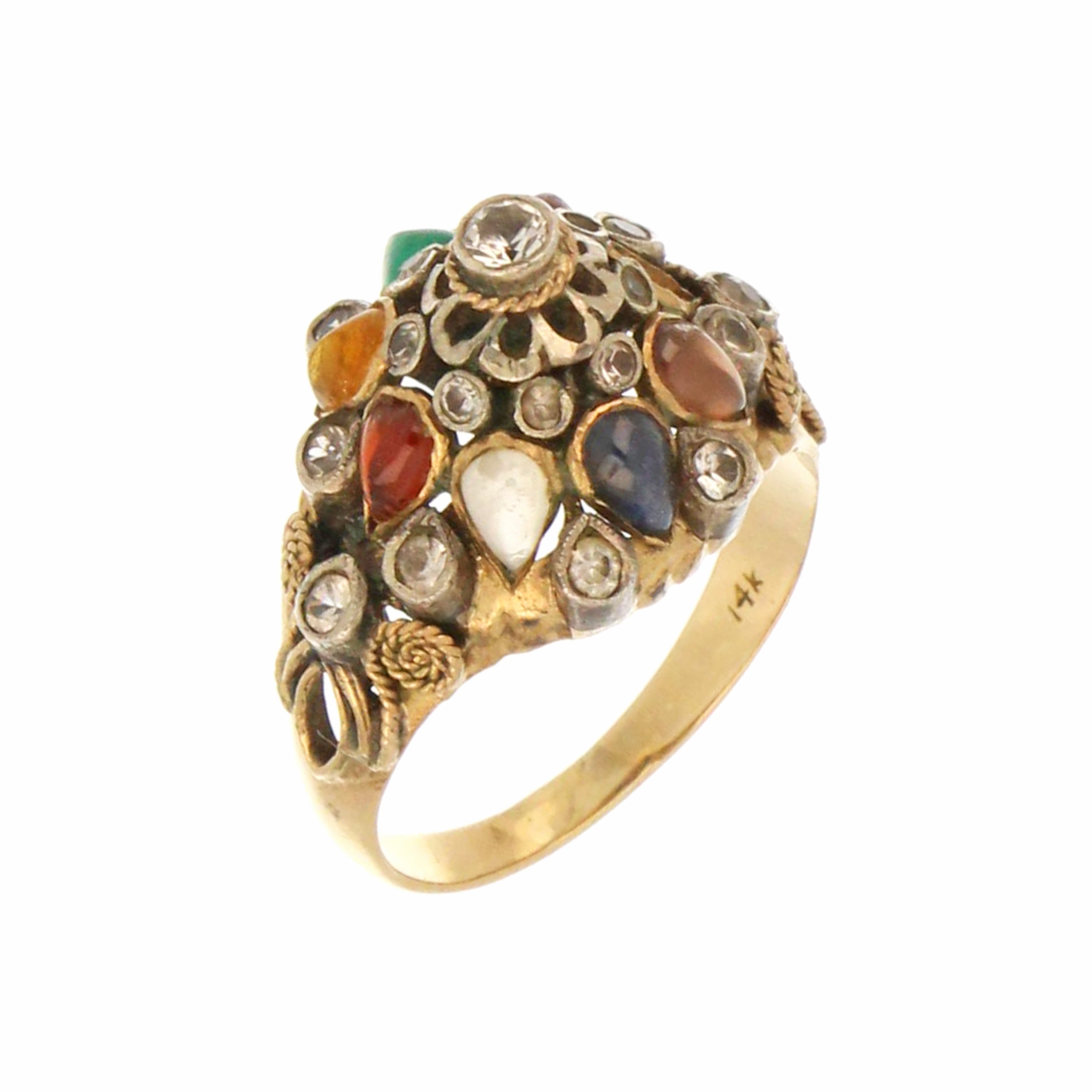 close-up of colorful gemstone ring with intricate gold detailing
