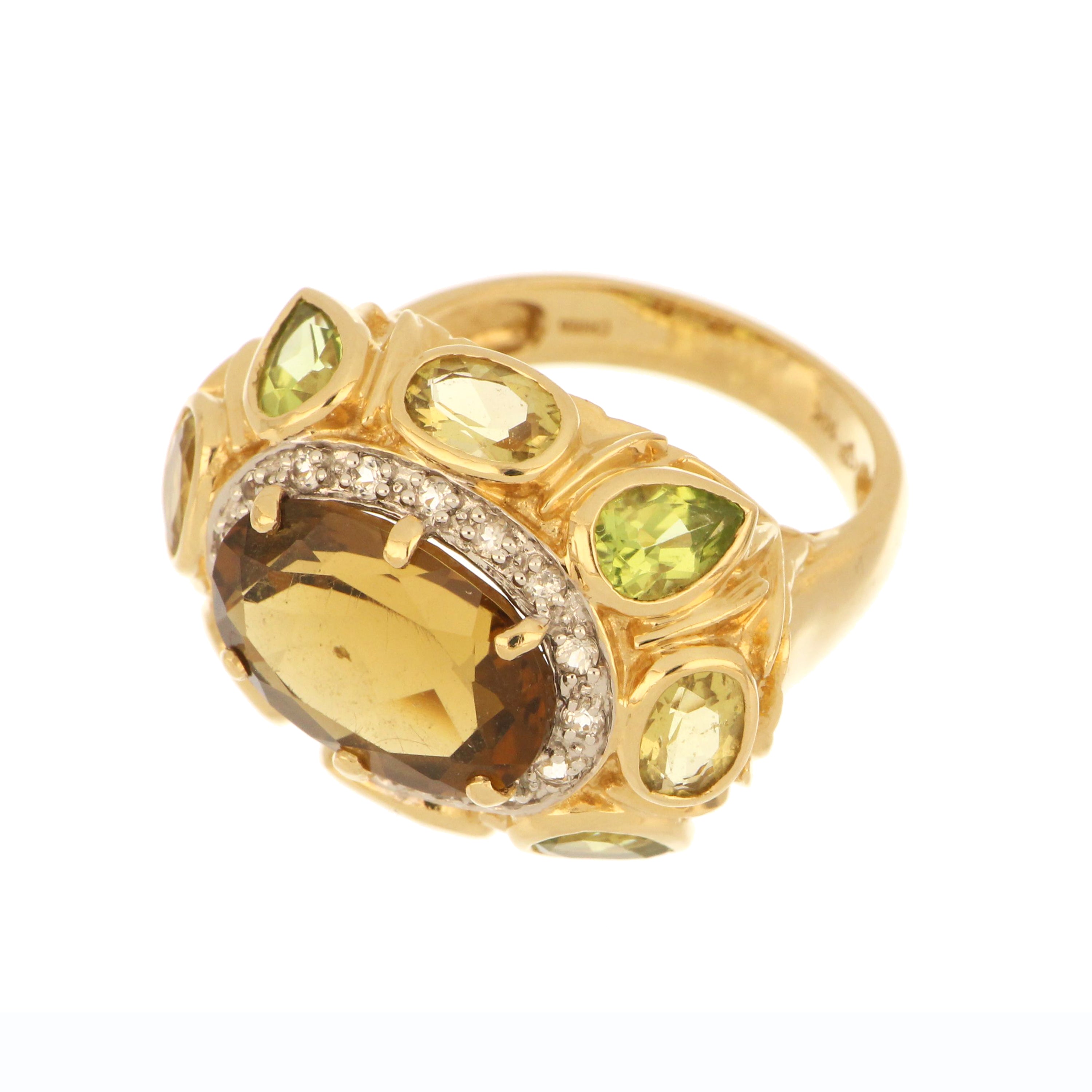 close-up of oval smoky quartz with peridot and citrine setting