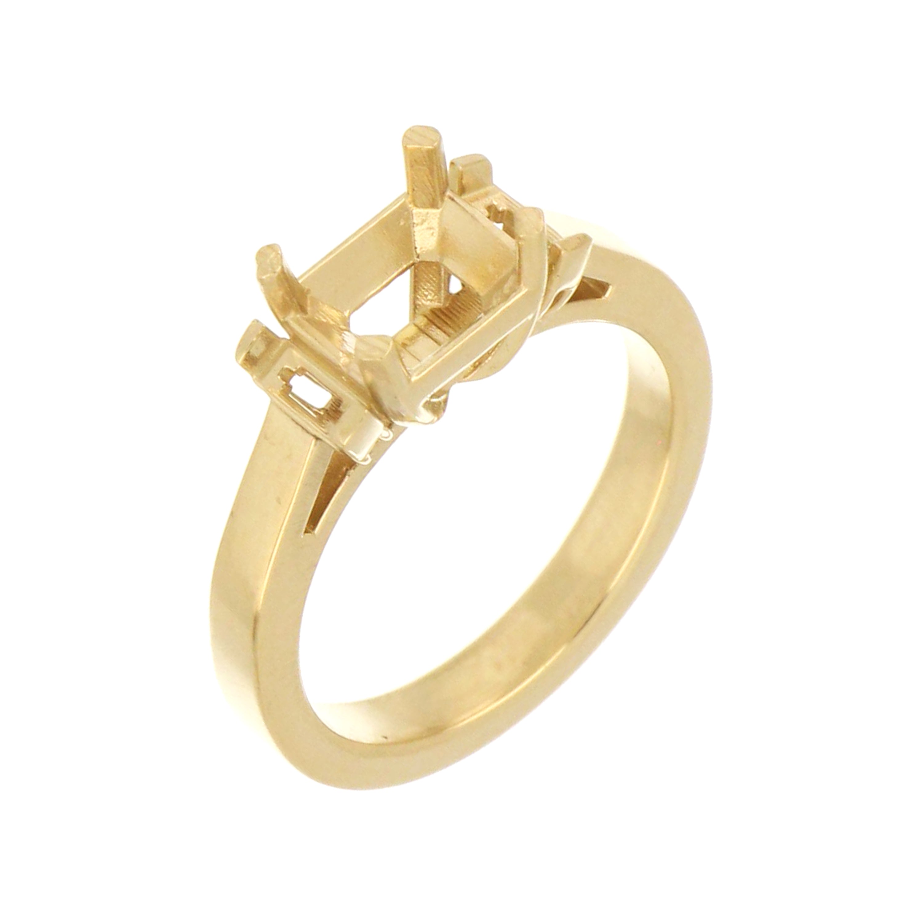 Yellow gold ring base with channel shoulders designed for emerald cut gemstone.