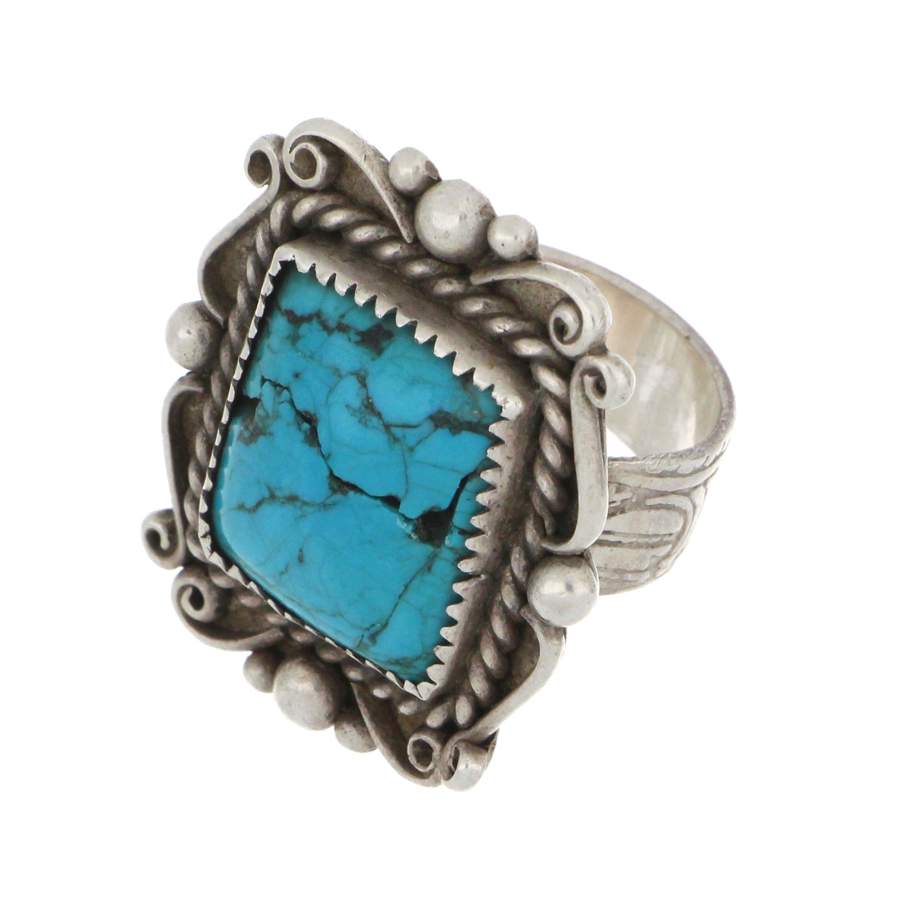 Sterling silver turquoise ring with ornate handcrafted setting