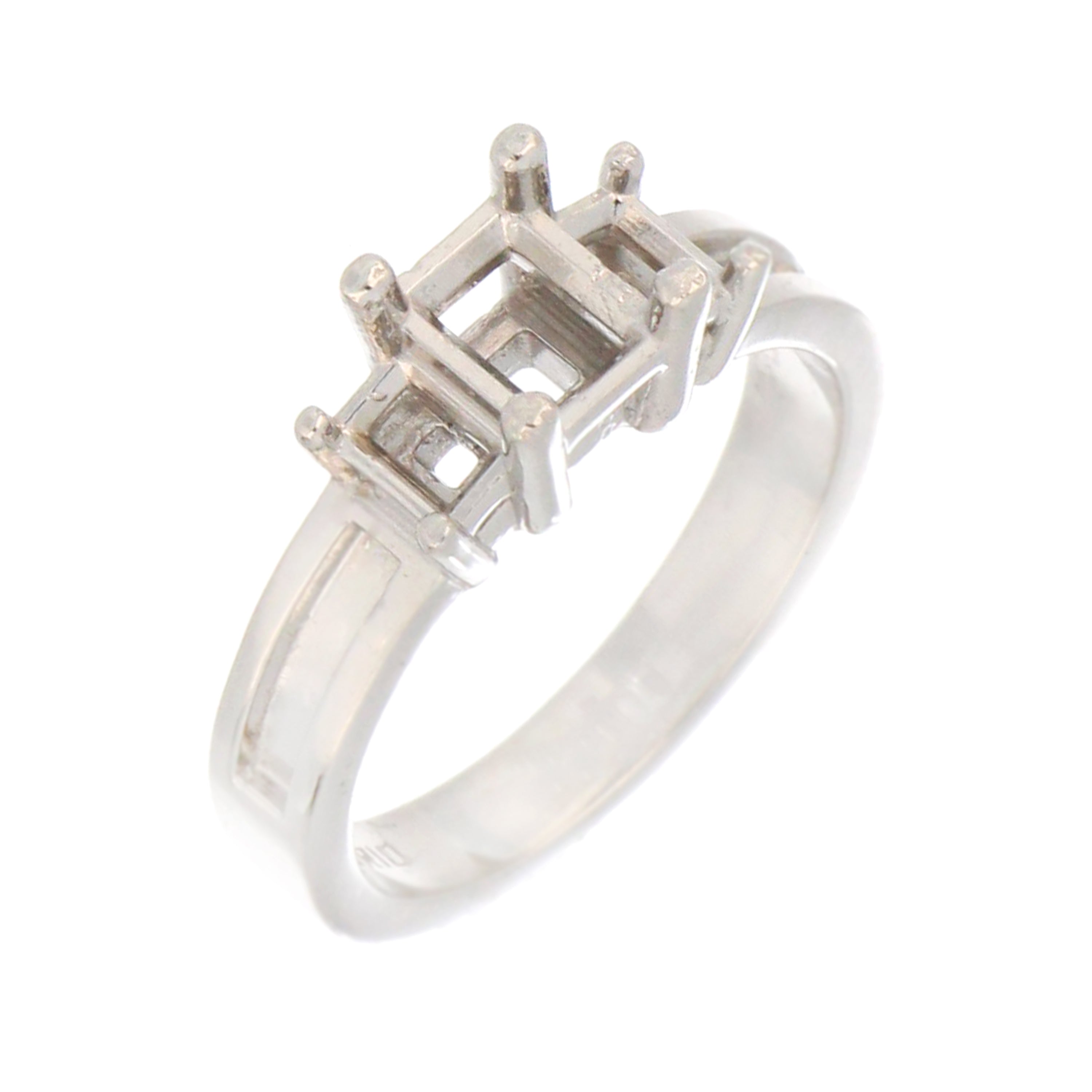 Side view of white gold ring setting for 6x5mm baguette center stone