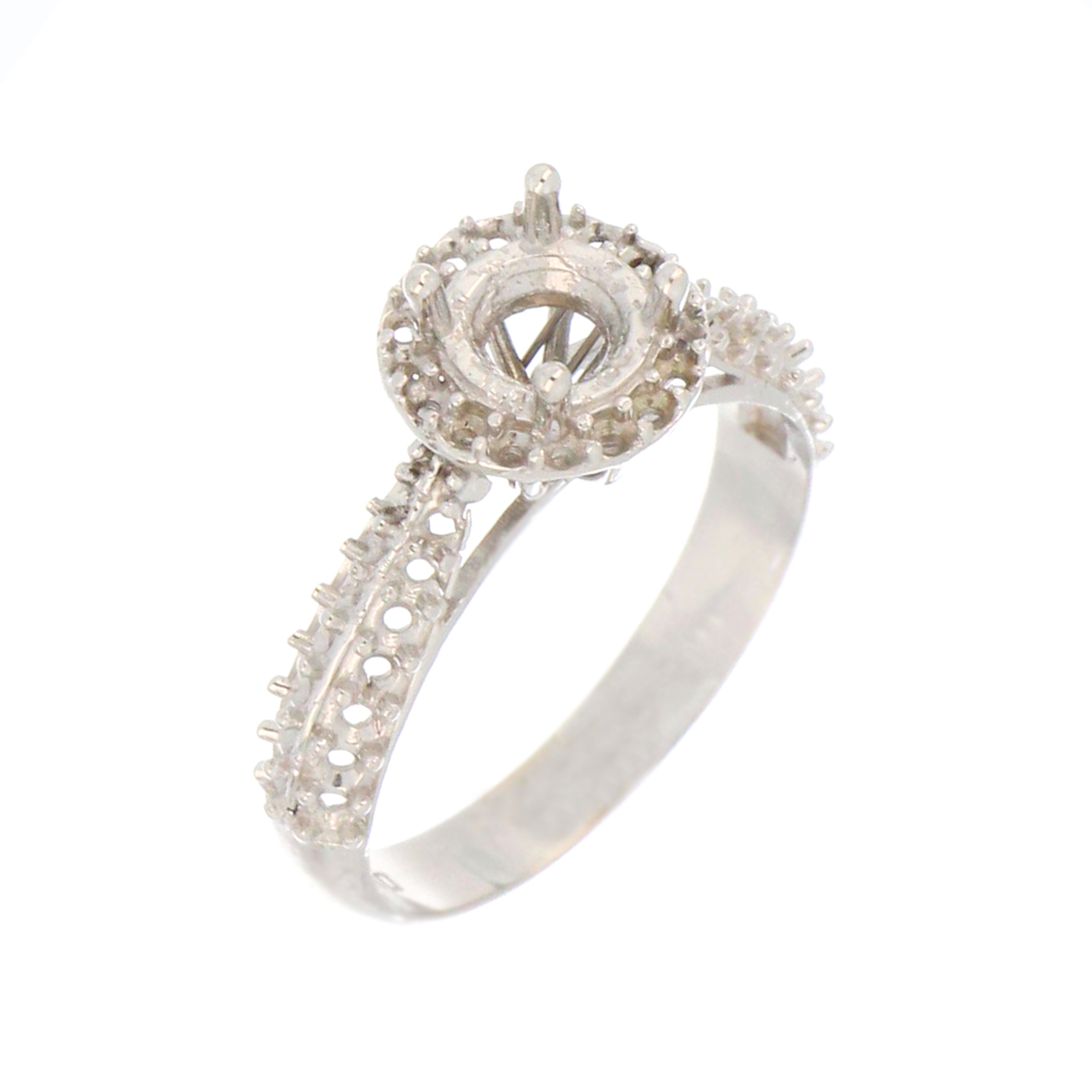 Side view of white gold halo engagement ring mounting for 6mm center stone