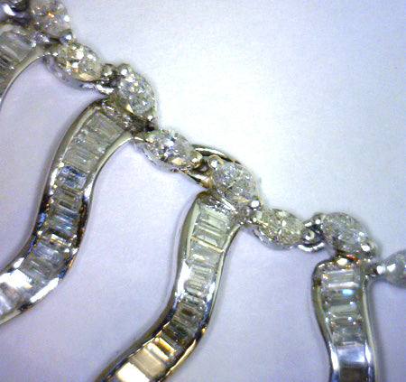 Detailed image highlighting baguette cut diamonds on 18kt white gold necklace with brilliant sparkle