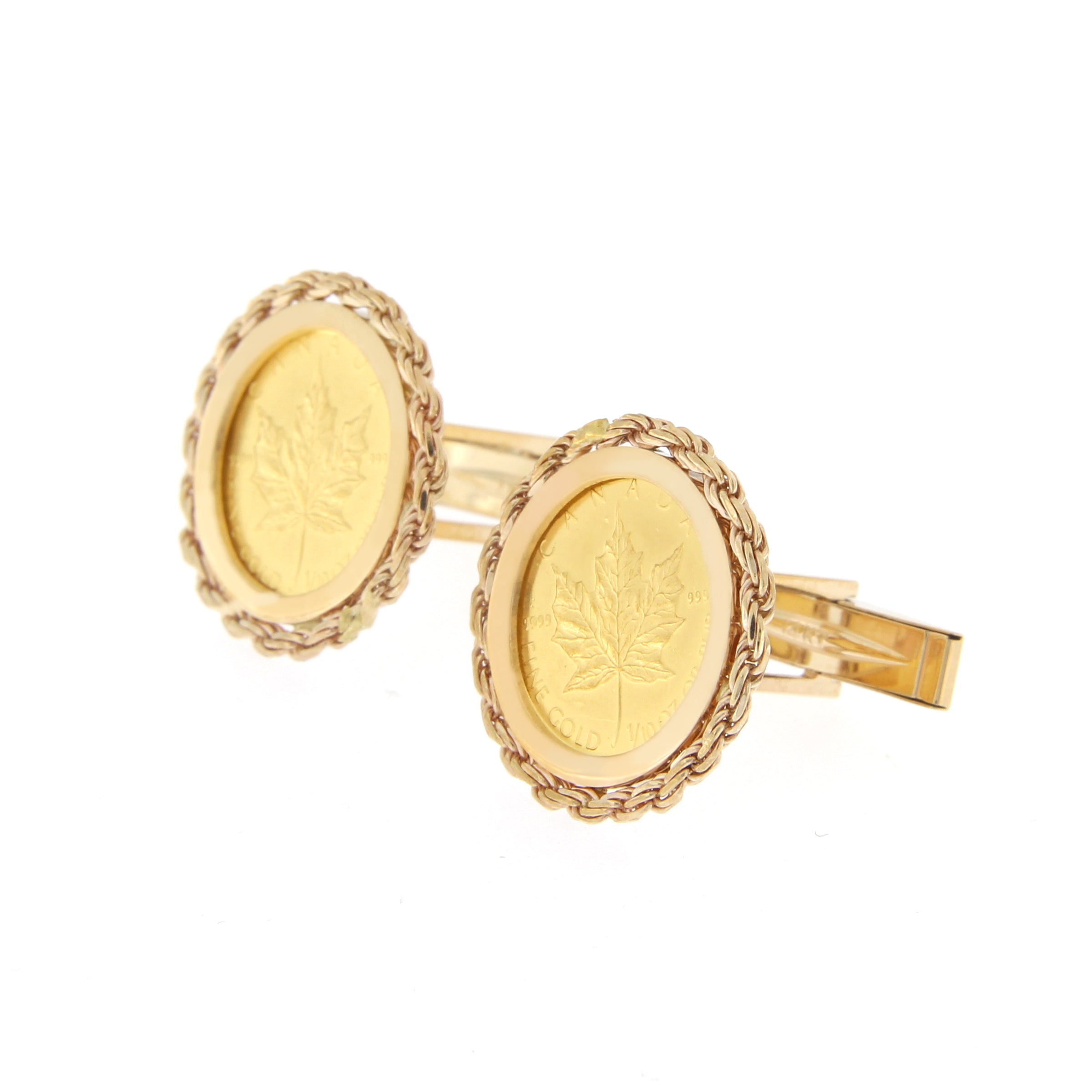 Close-up of 14kt yellow gold cufflink with embedded 1/10 oz gold Maple Leaf coin, highlighting coin design and gold finish