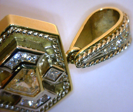 Side profile of diamond pendant highlighting the bezel setting and mixed metal finishes
