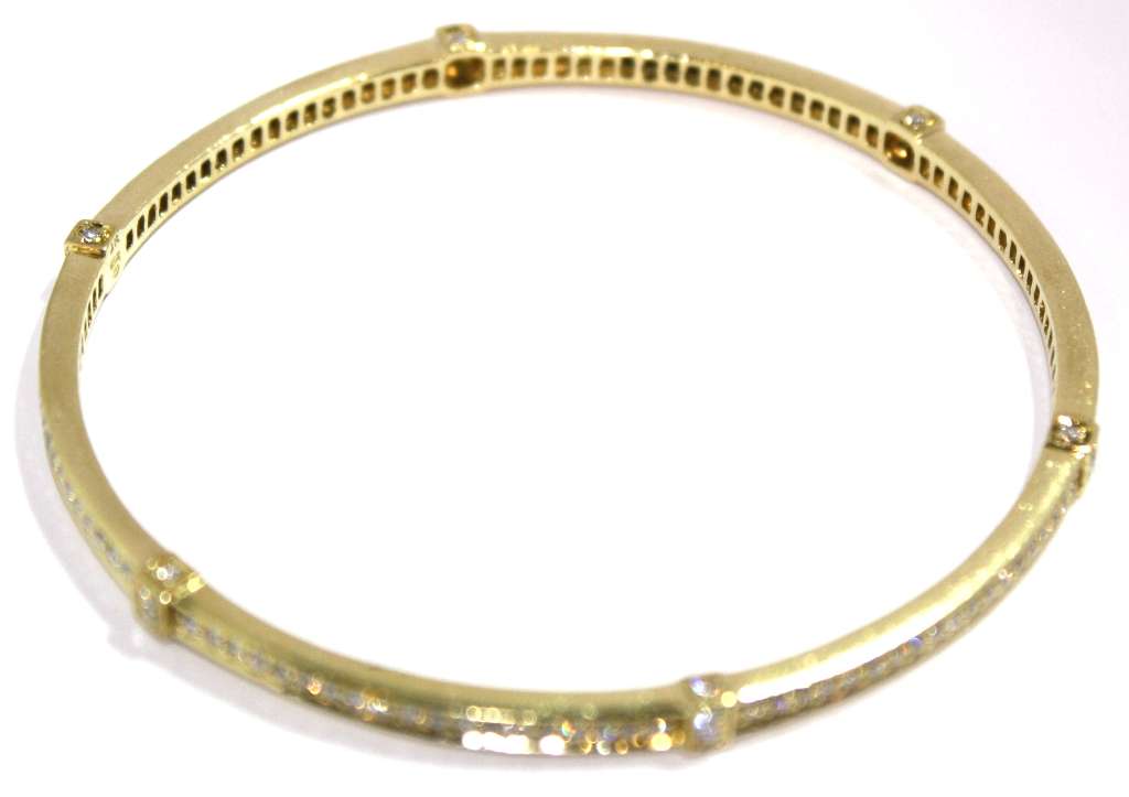 Full length image of elegant 18kt yellow gold diamond bangle weighing 17.85 grams, with high-quality G-H color diamonds