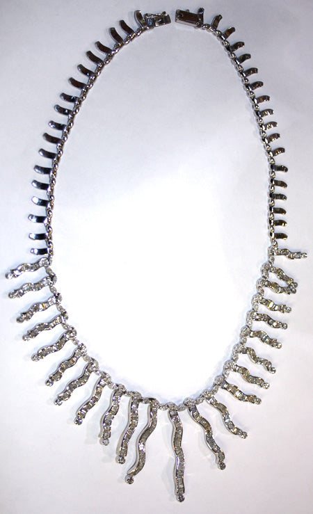 Elegant 18 inch ladies' 18kt white gold necklace displaying marquise and round brilliant diamonds