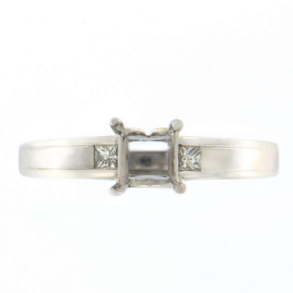14kt white gold ladies ring mounting side angle showing two princess cut diamonds totaling 0.10cttw
