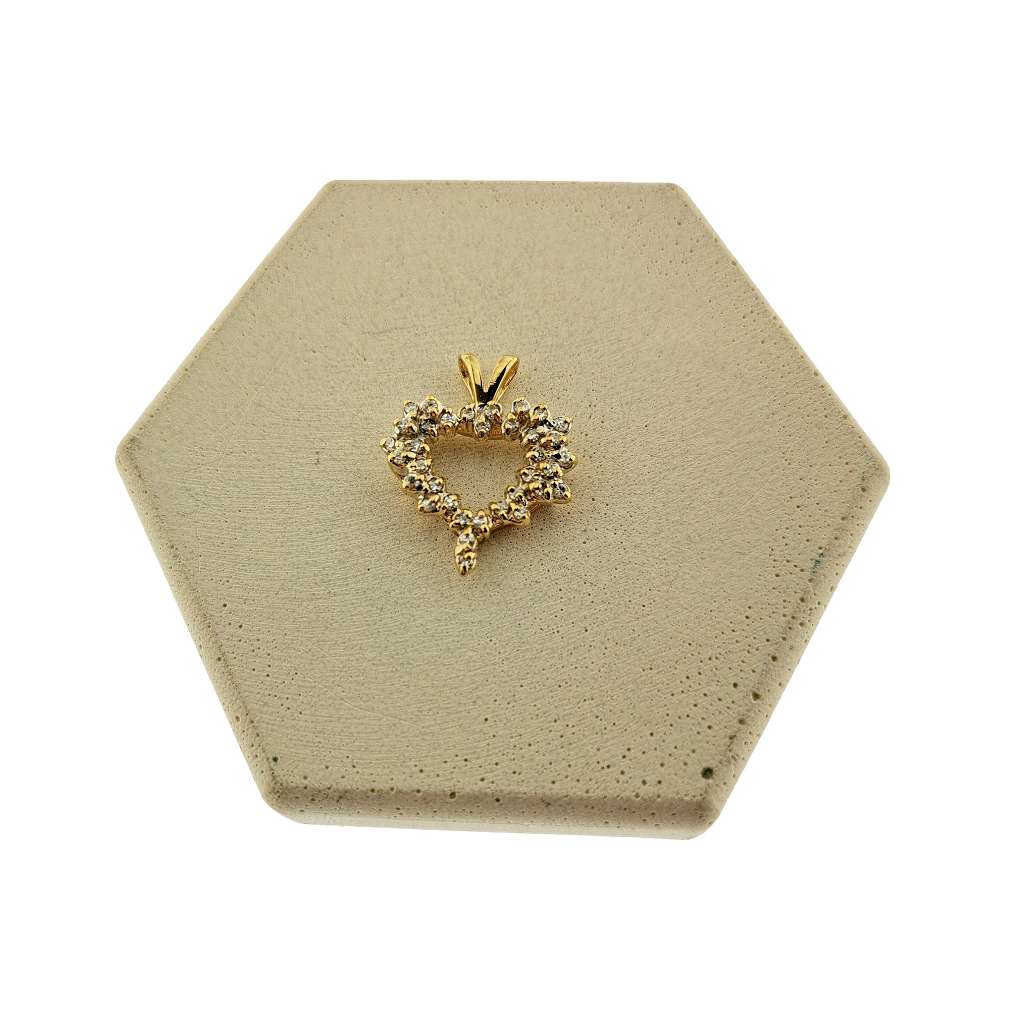 14kt yellow gold heart pendant adorned with 35 single cut diamonds, close-up front angle