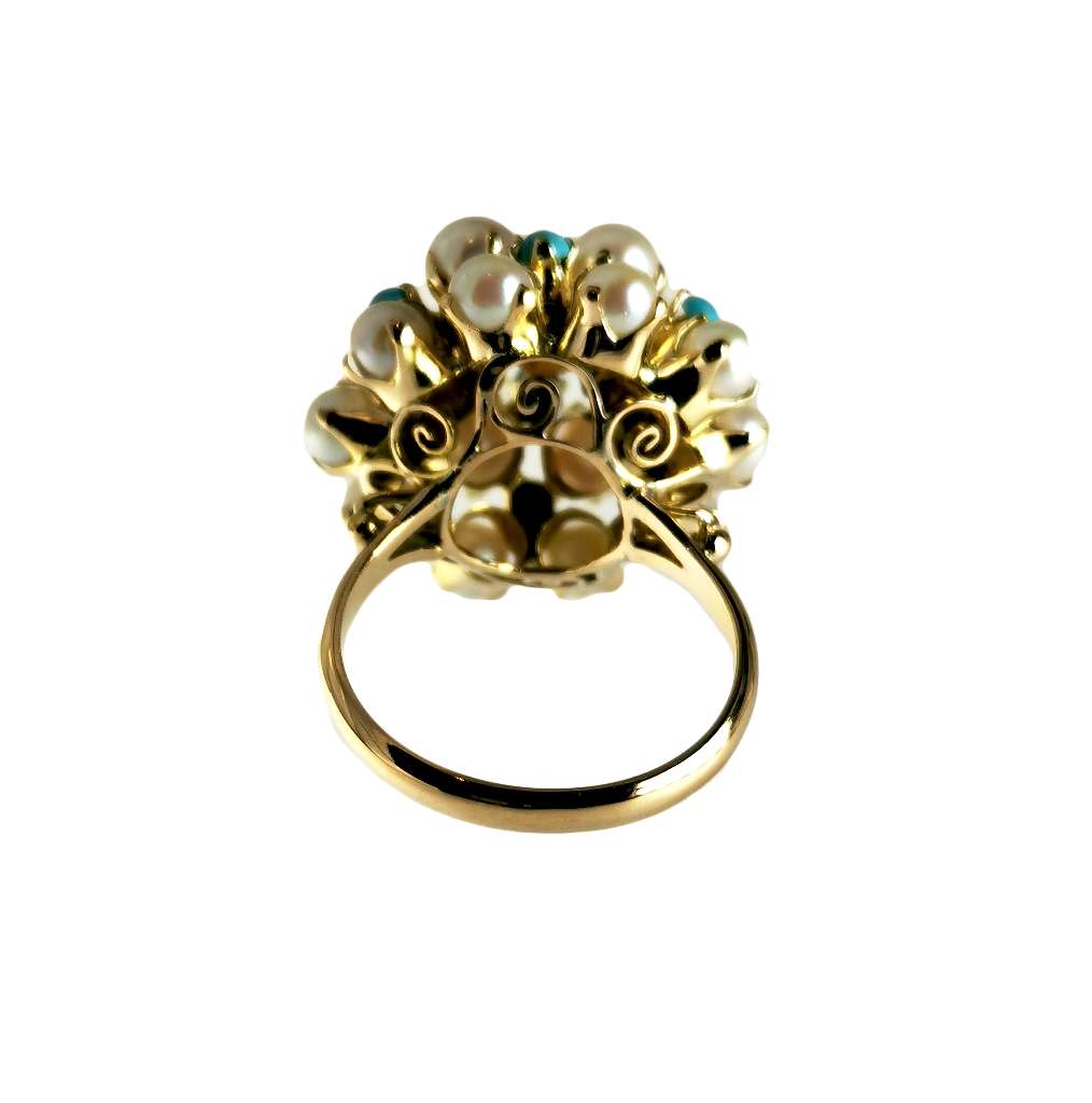 Close-up detail of 8kt yellow gold ring cluster with lustrous white cultured pearls and vibrant turquoise stones