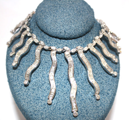 Close-up of ladies' 18kt white gold diamond necklace featuring marquise, baguette, and round cut diamonds