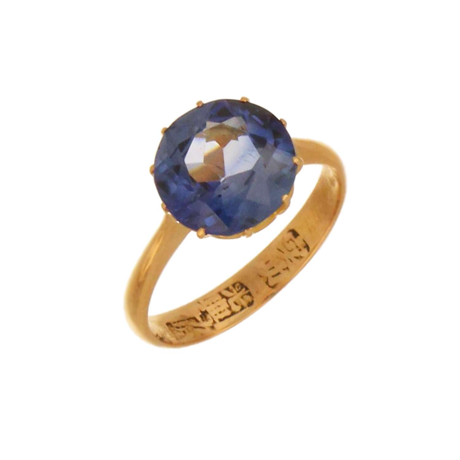 Side profile of elegant 21kt yellow gold synthetic blue sapphire dinner ring weighing 2.92 grams