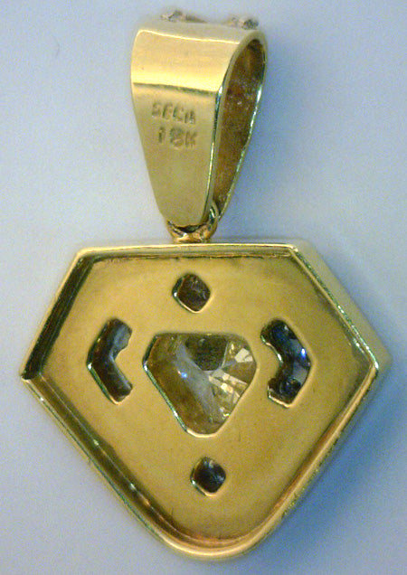 Top view of diamond pendant illustrating craftsmanship and luxury design in yellow and white gold