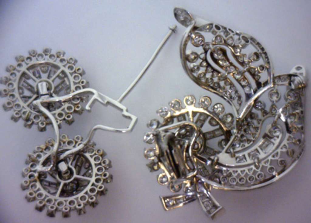 Brooch convertible to pair of stud earrings, displayed flat with flower diamond clusters