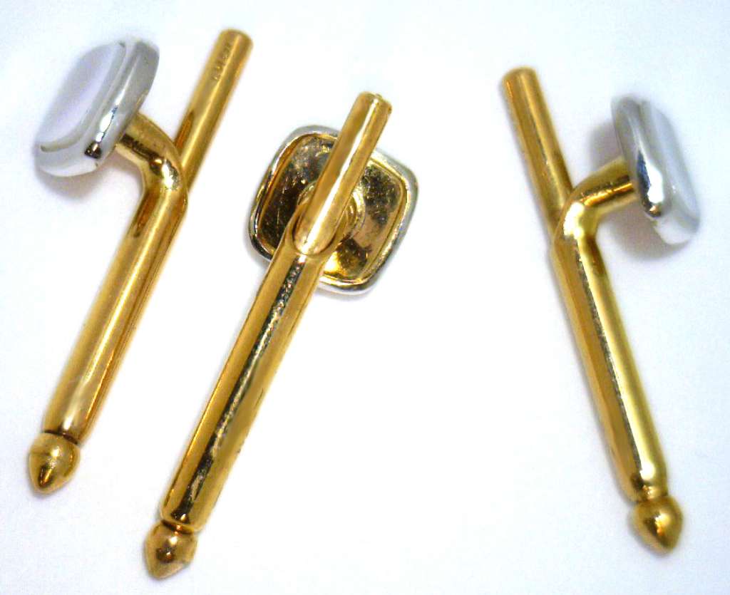 Set of three 10kt yellow gold and white gold shirt studs displaying mother-of-pearl stones from top view
