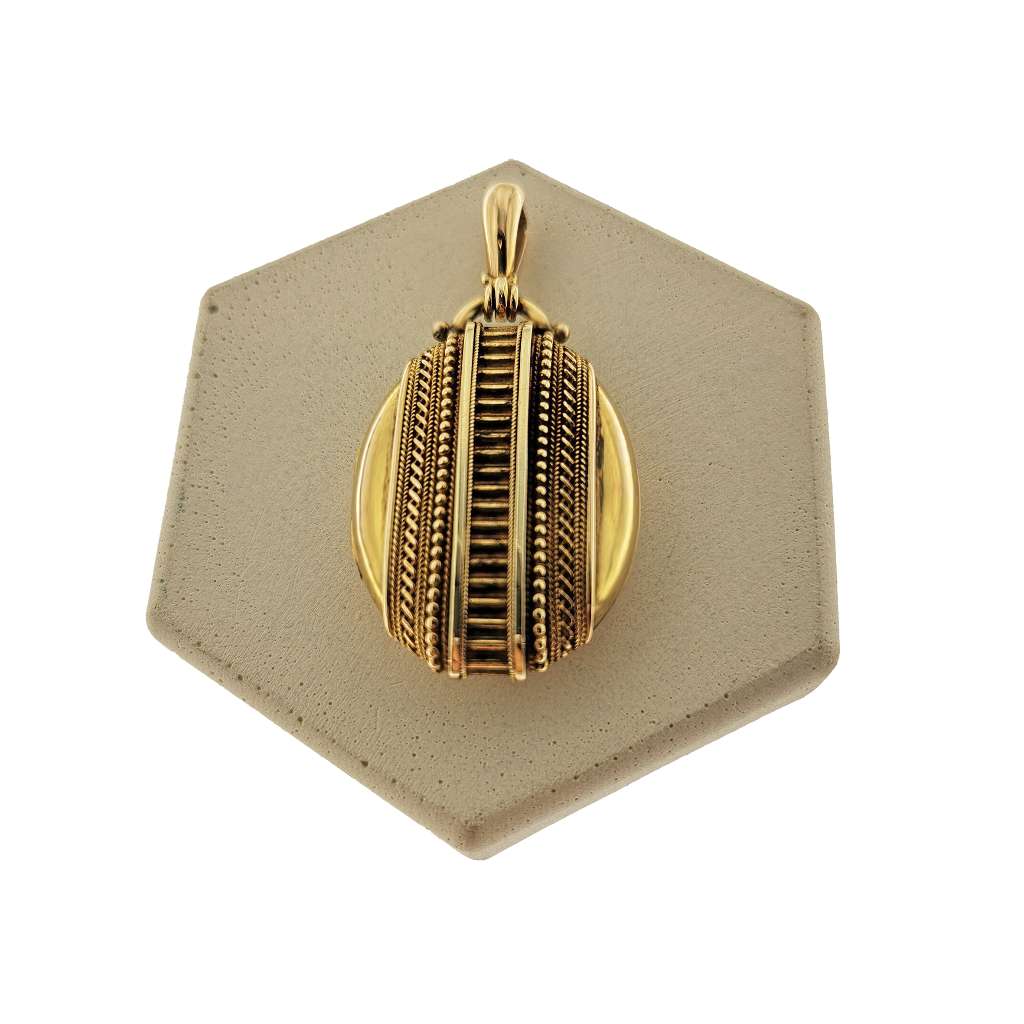 16kt yellow gold antique style locket pendant front view with intricate design, approximately 11.45 grams