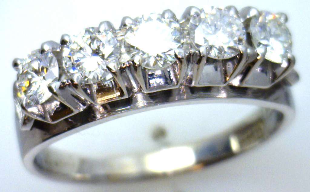 Ladies' white gold diamond ring top view showing five round brilliant cut diamonds with sparkling clarity