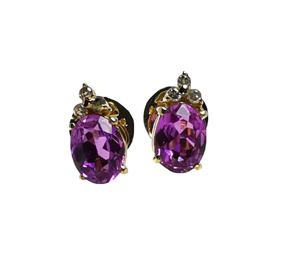 Close-up of 12kt yellow gold synthetic pink sapphire earring showcasing oval gemstones and diamond accents