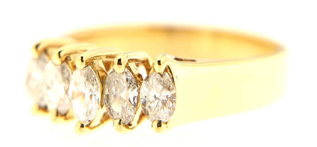 Top view of elegant 14kt yellow gold diamond ring featuring five marquise-shaped diamonds in claw settings