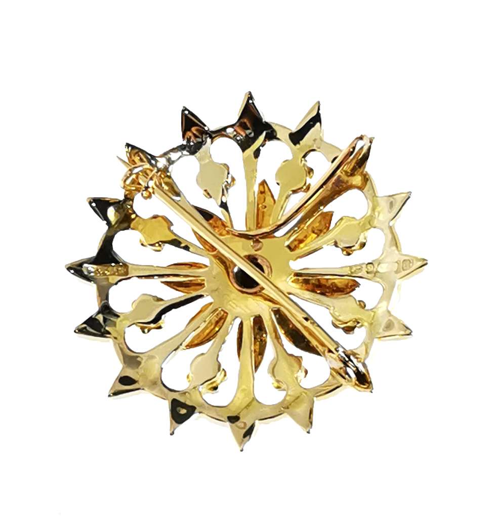 Close-up of 9kt yellow gold flower brooch with white seed pearls, detailed cluster design
