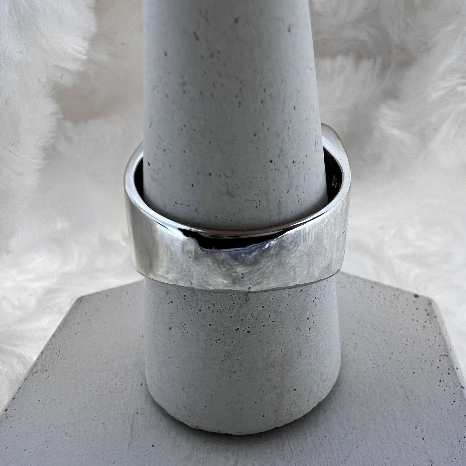 Top view of luxurious 18kt white gold ring with 44 princess cut diamonds weighing total 5.28 carats.