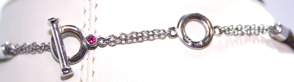 Elevated view of pendant displaying cluster of VS1 to SI2 clarity diamonds in champagne and white shades