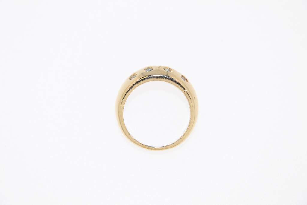 Side profile of 10K yellow gold ring with dome design featuring single cut diamonds with total 0.17cttw