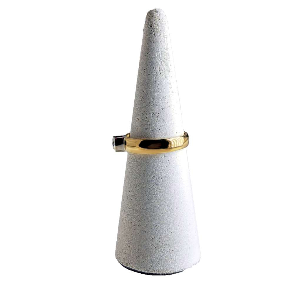 Close-up side profile of 14kt yellow gold ring highlighting diamond setting and gold band